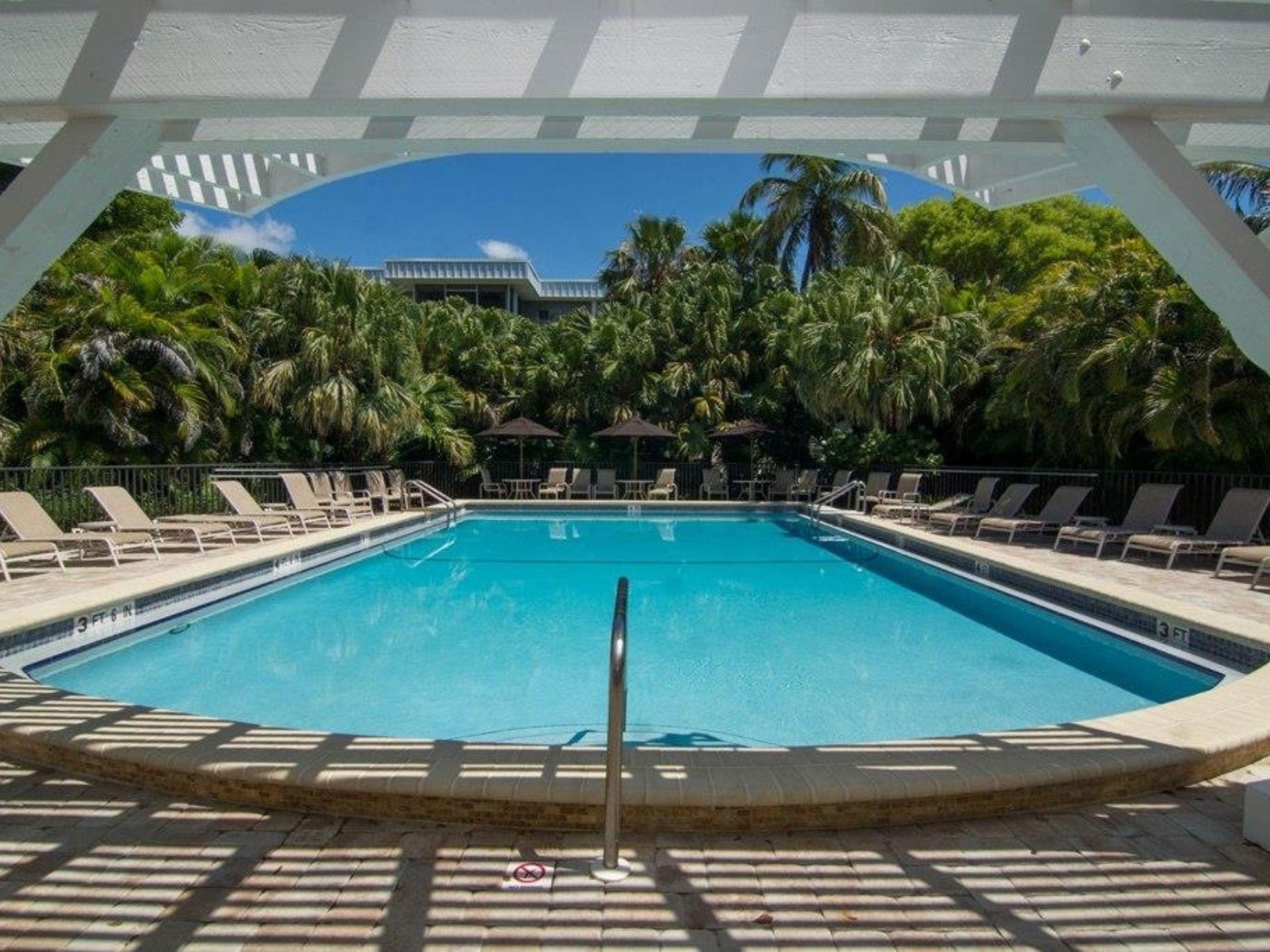 The outdoor swimming pool at Island Beach Club