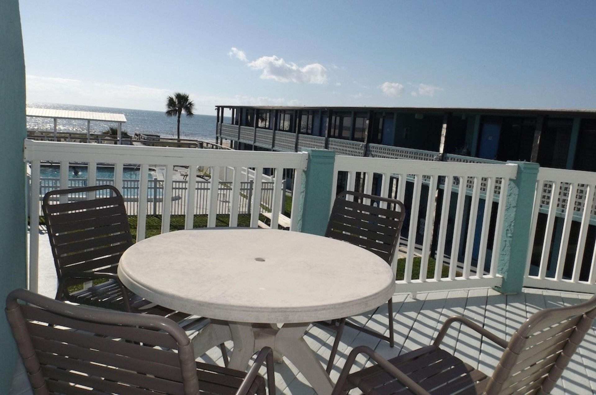 A balcony overlooking the water and the courtyard