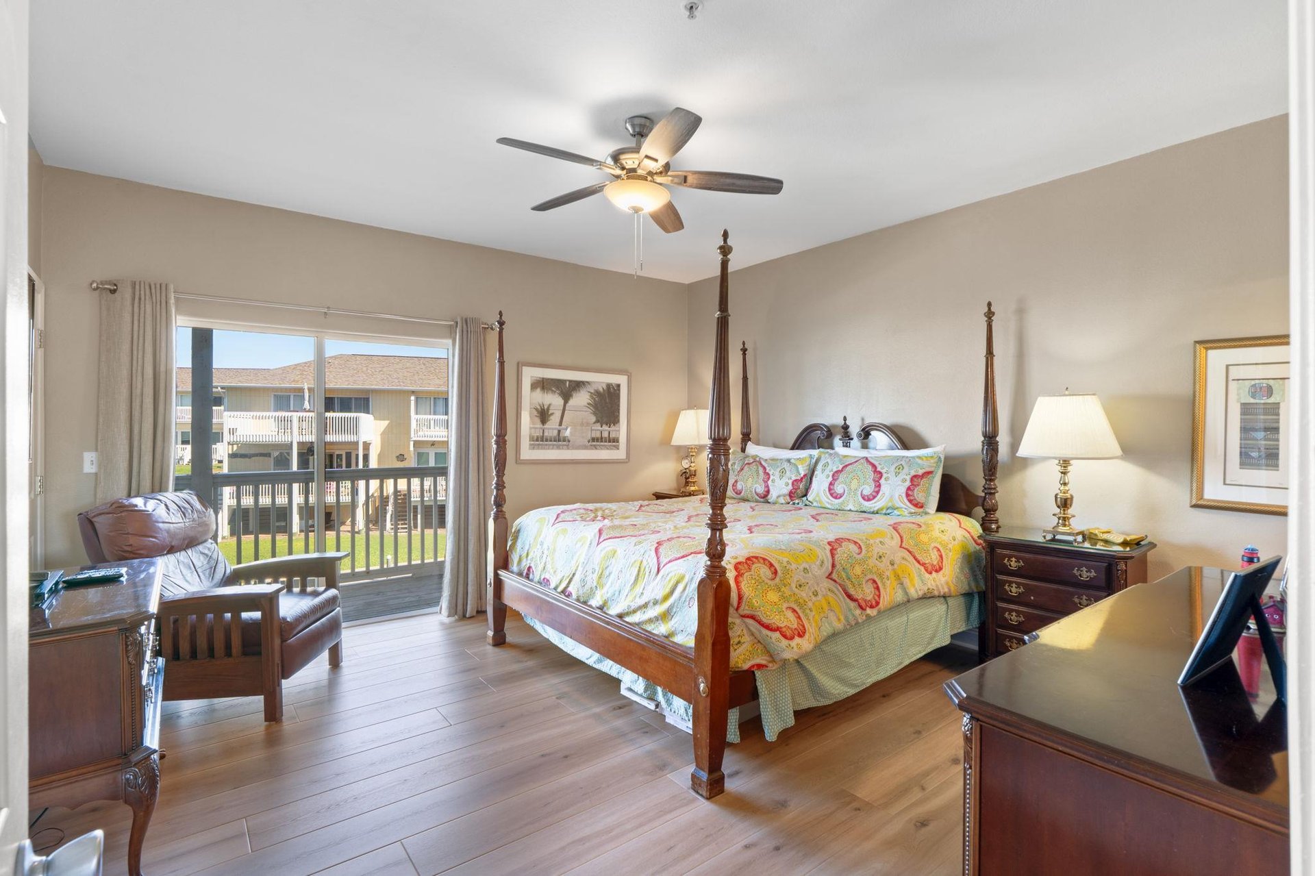 Primary bedroom with balcony view