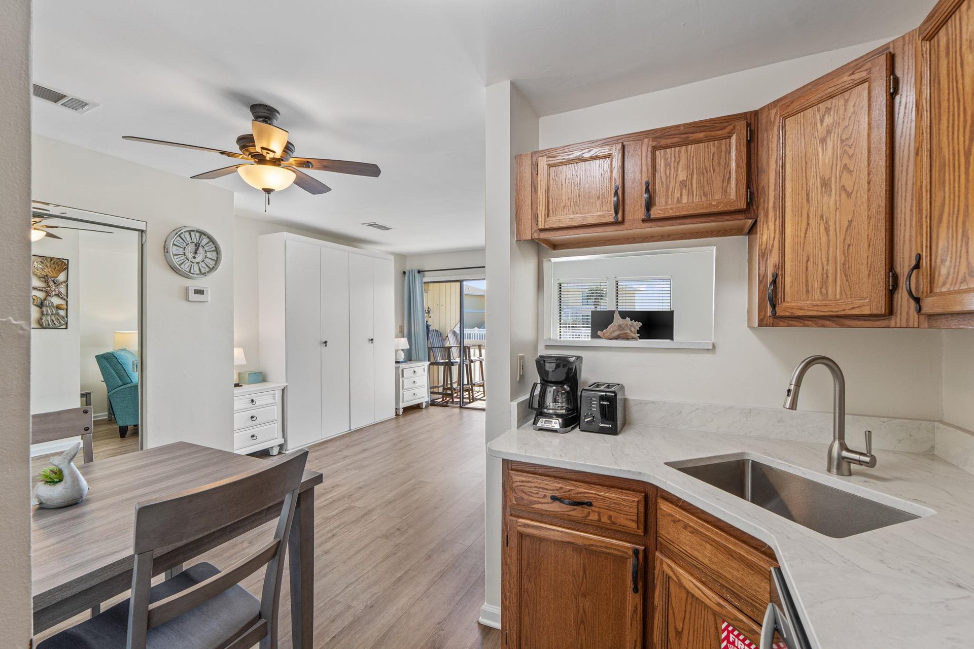 Kitchen view of dining area and Murphy bed