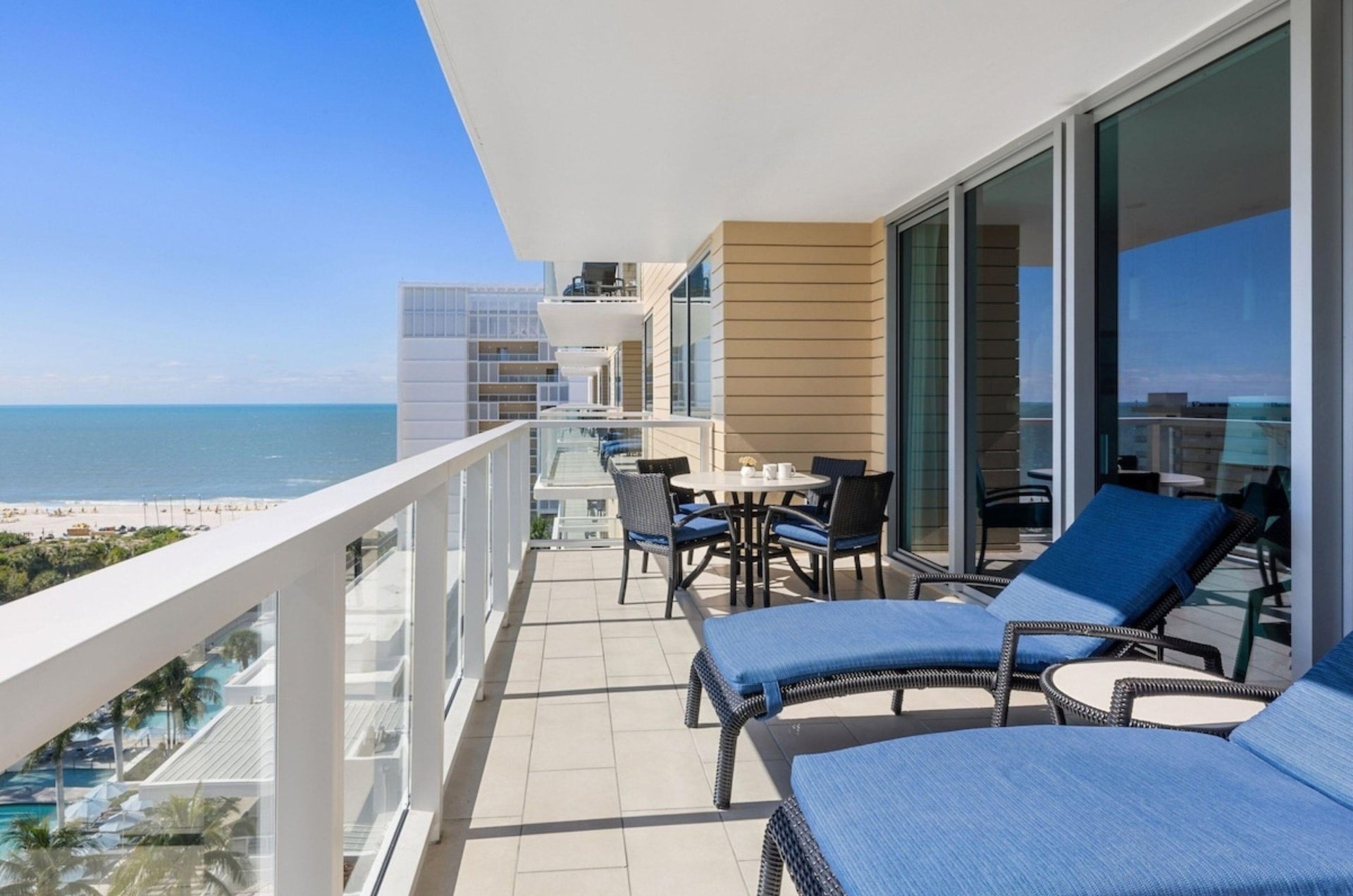 A balcony with loungers at Crystal Shores