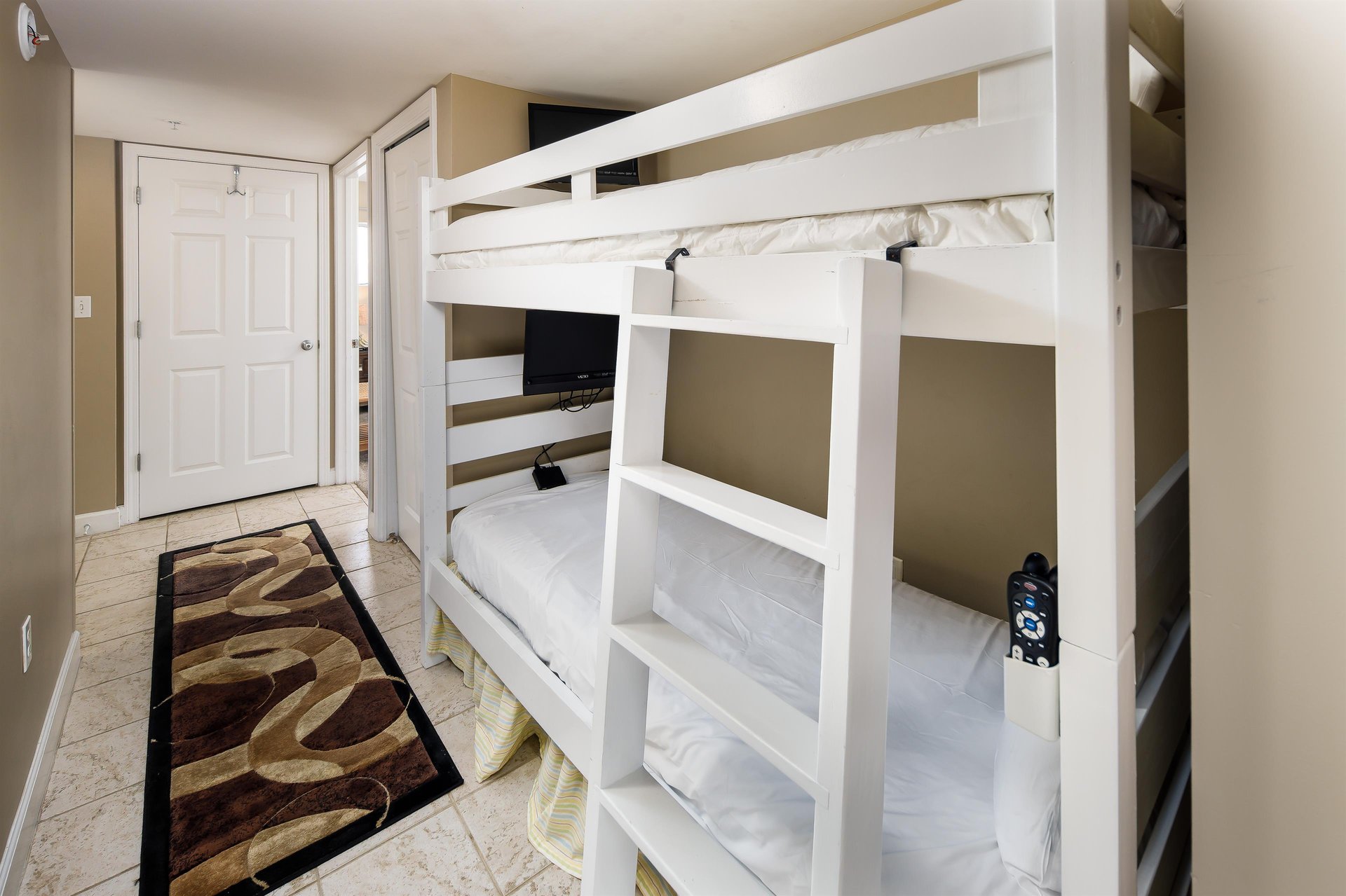 To the extreme delight of our younger guests, the bunk area features two flatscreen TVs, one for each bunk