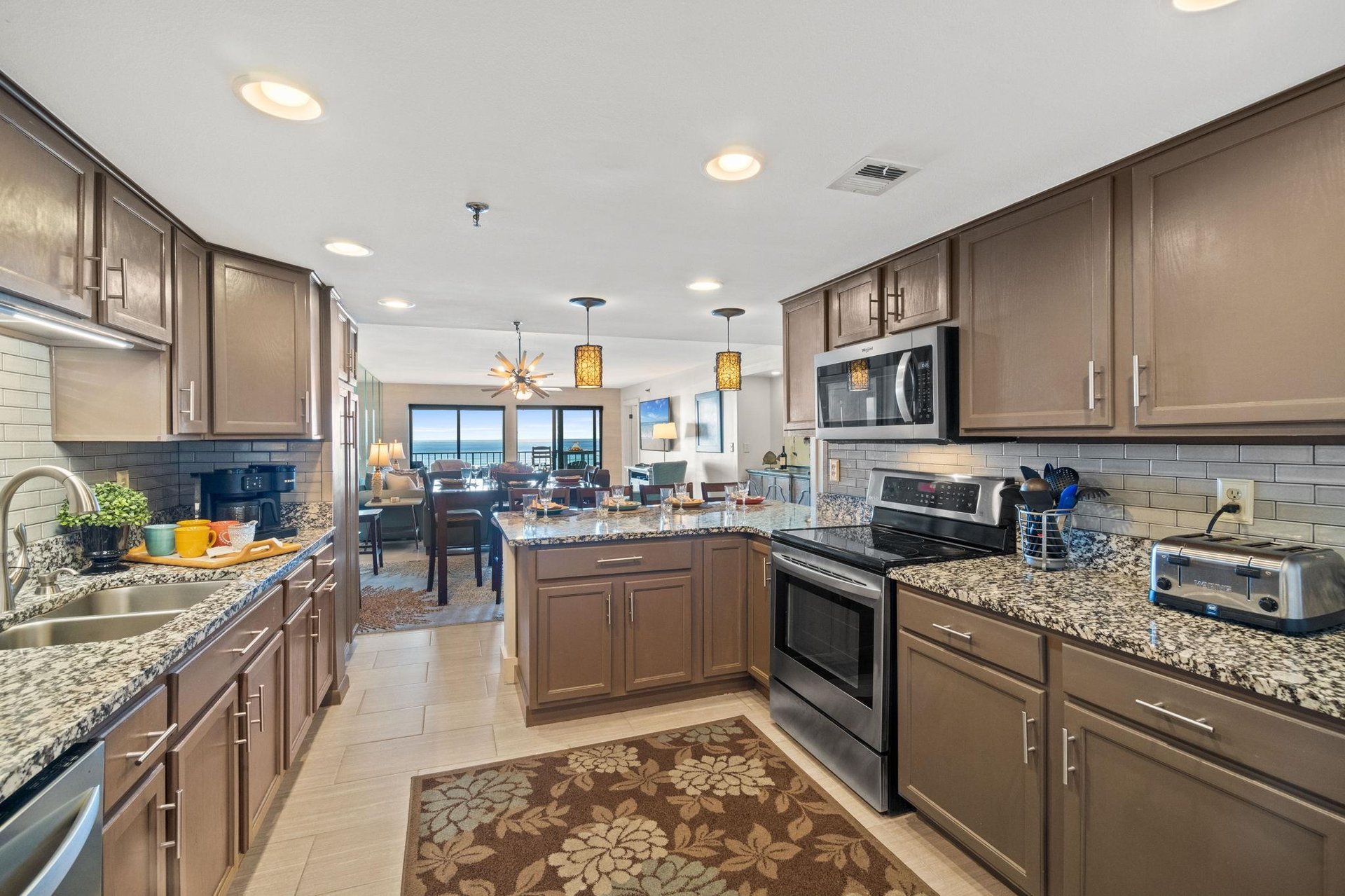 Upscale appliances, granite counter tops and customnew cabinetry. Plenty of space for little helpers here Lunch and dinner will be a breeze