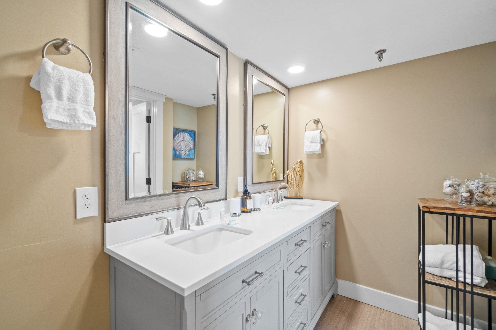 Master bath view with his and her vanity sinks perfect for a quick cleanup before a night on the town