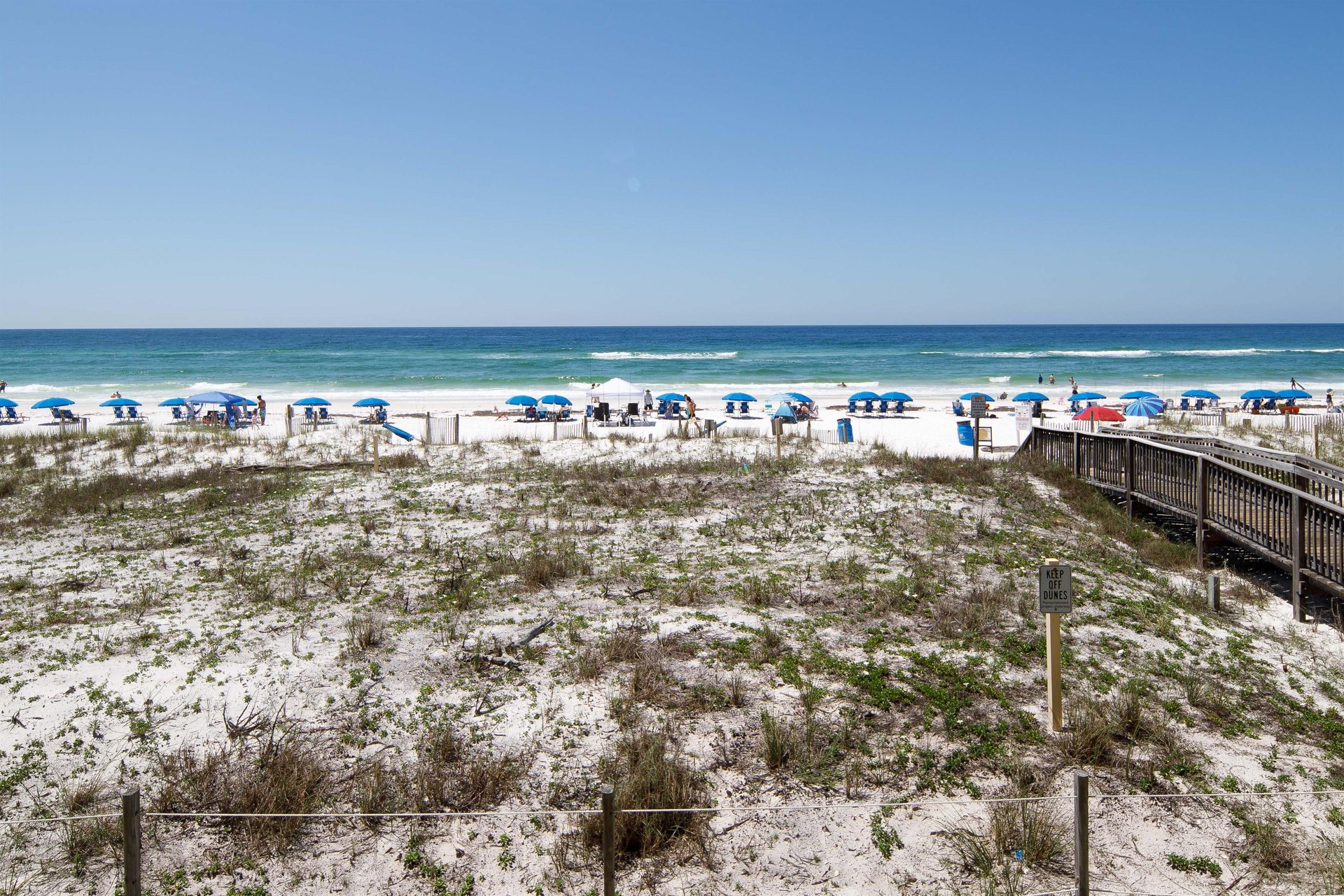 Serenity and rest await you Balcony View of the pristine white sugarsand beaches and the emerald green waters...AWAIT YOU