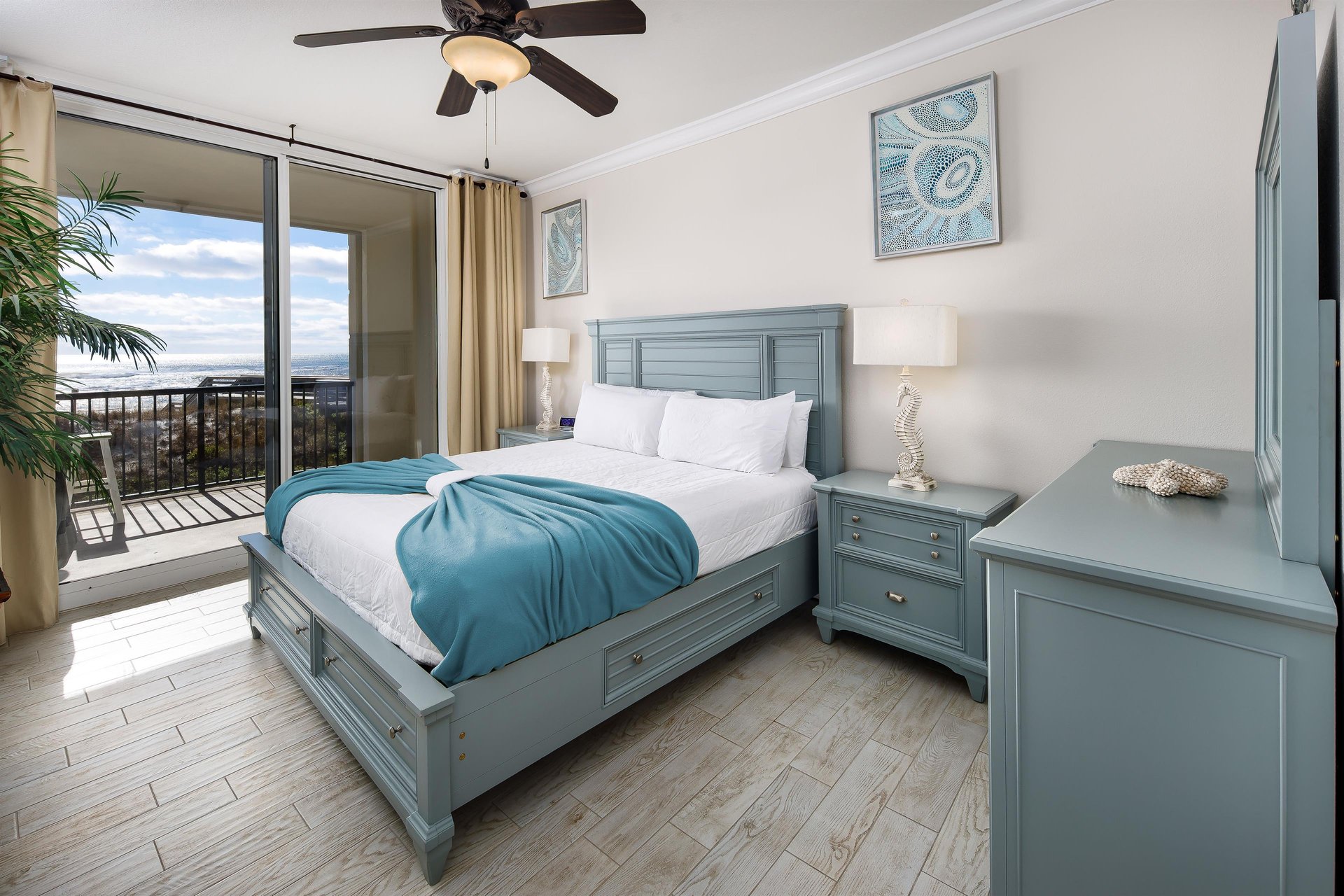 Charming primary bedroom with balcony access and direct access to a full bath with a walkin shower and jacuzzi tub.