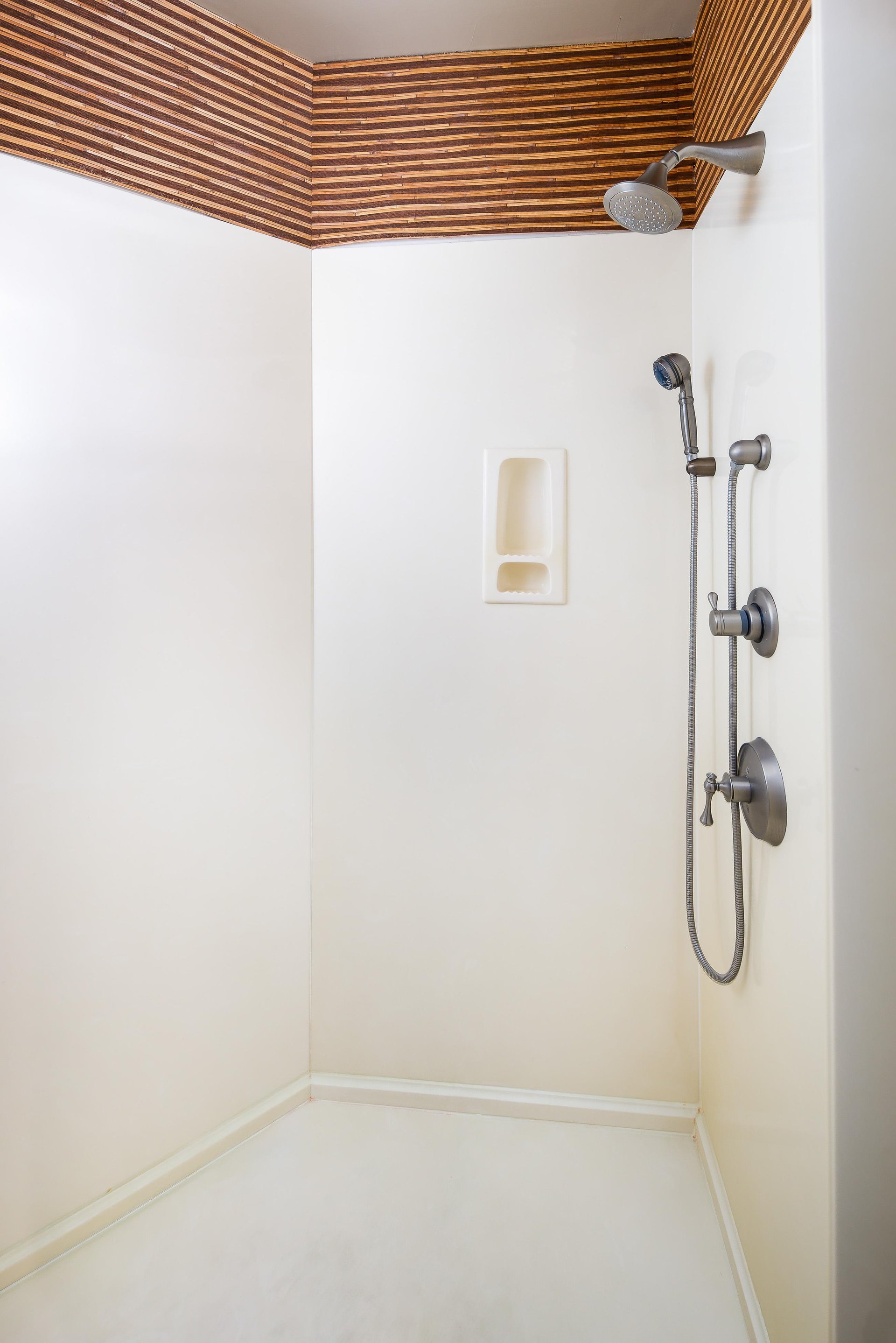 Standing shower with plenty of room and gorgeous granite counter tops with his and hers vanities