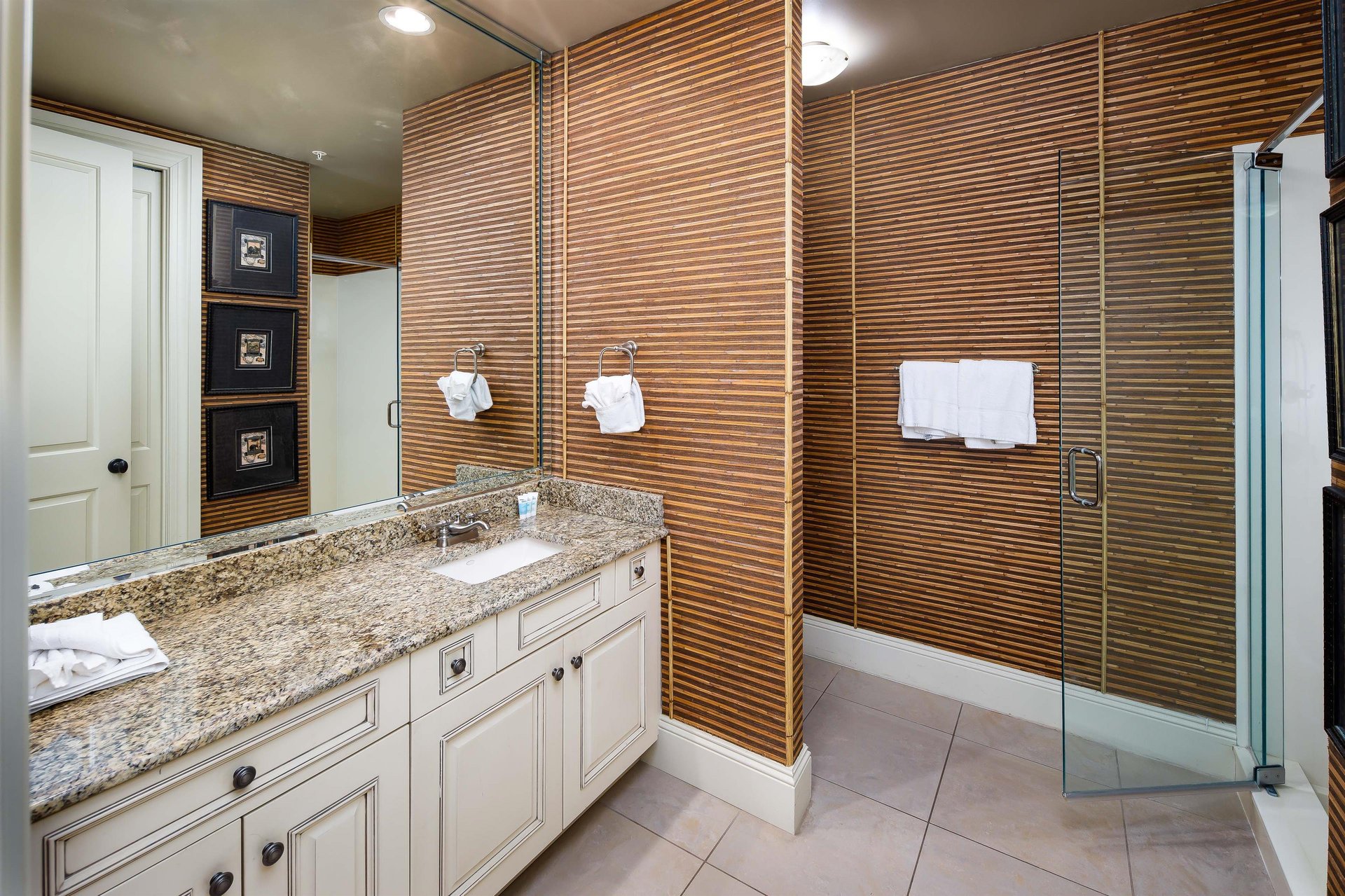 En suite bath off the first guest room with King fourposter bed