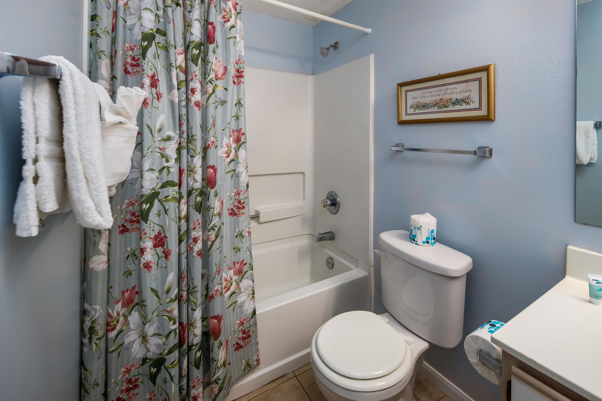 The guest bath is accessible from the hallway and the guest room.