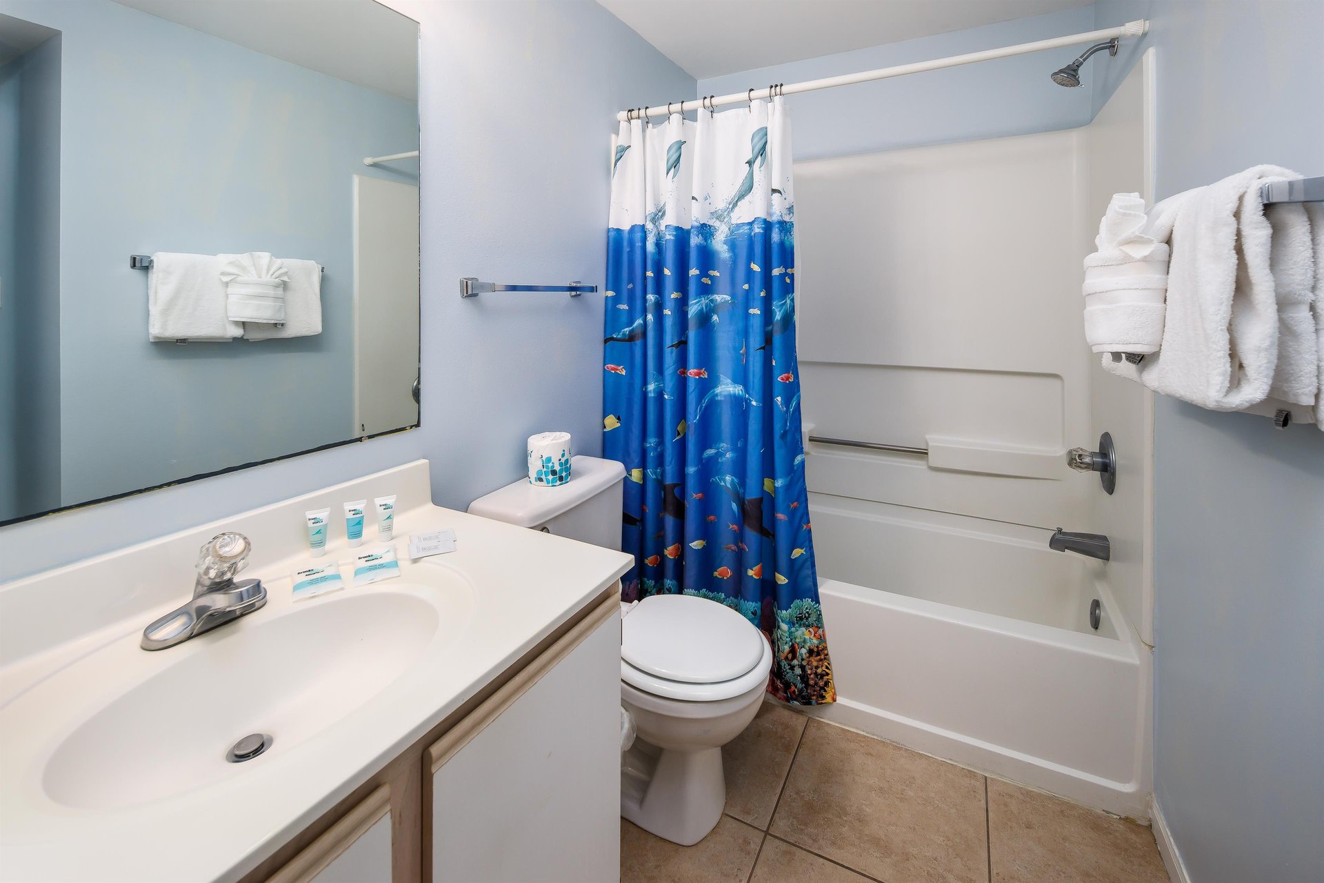 Private bath for the bedroom with twin beds.