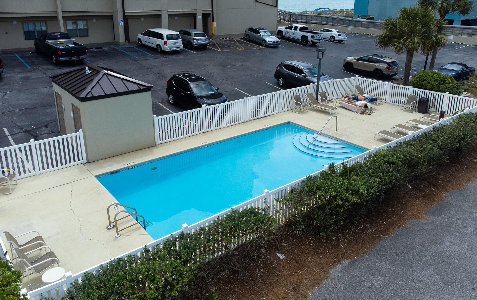 Emerald Towers West pool is located in the parking lot on the front side of the condominium.