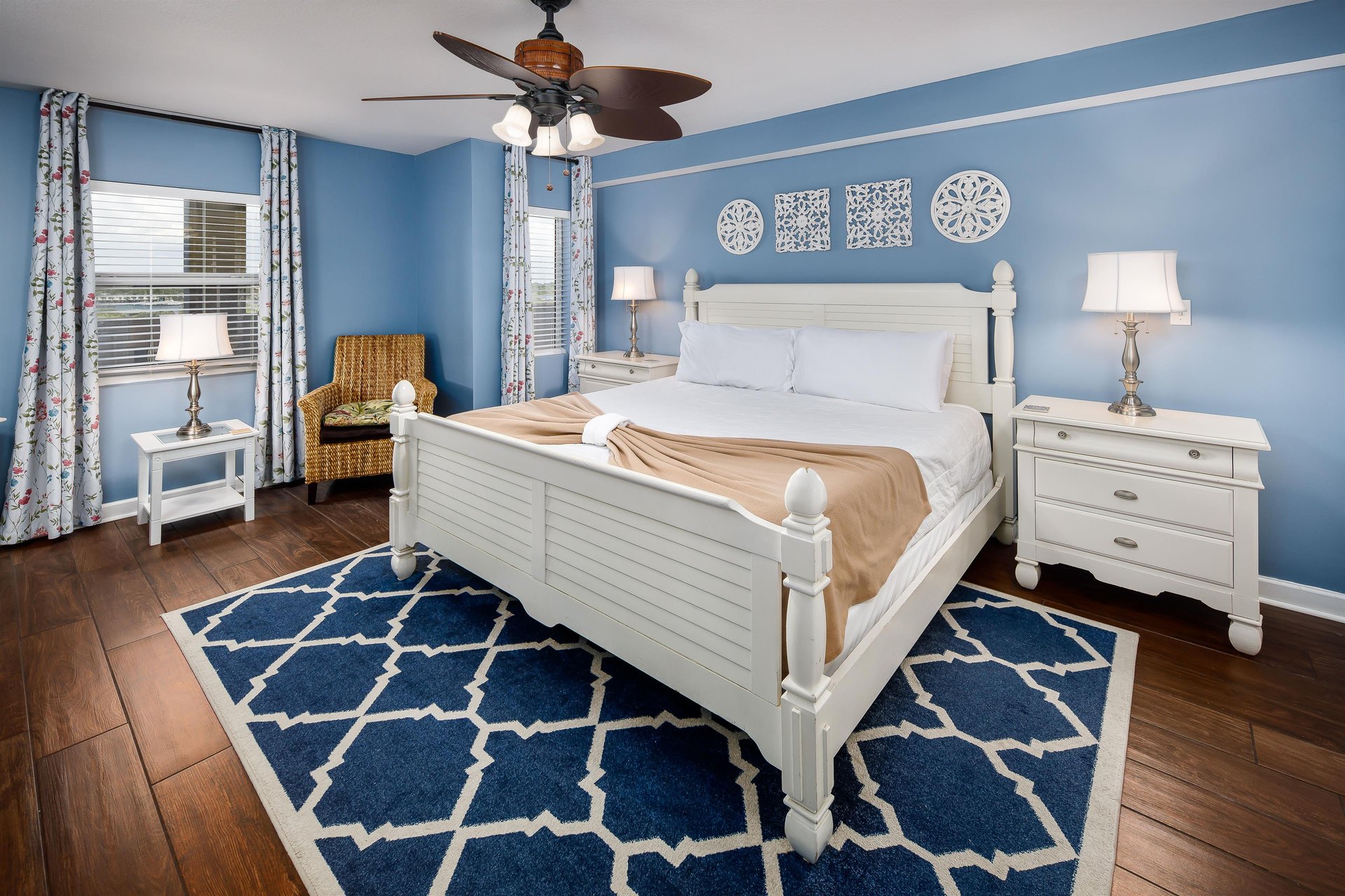 Beachy Bliss Bright blue walls complement stylish decor in this inviting bedroom retreat