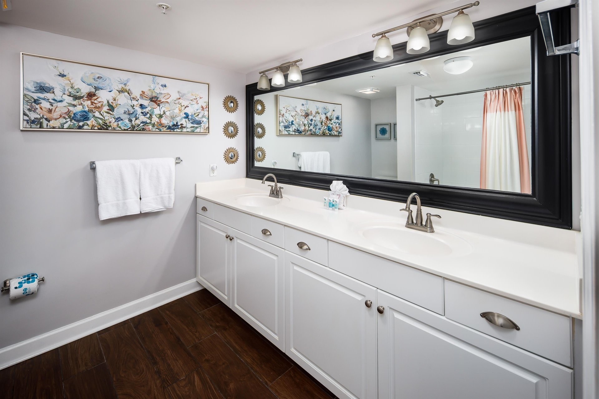 Master bath boasts double sinks and a tubshower combo.