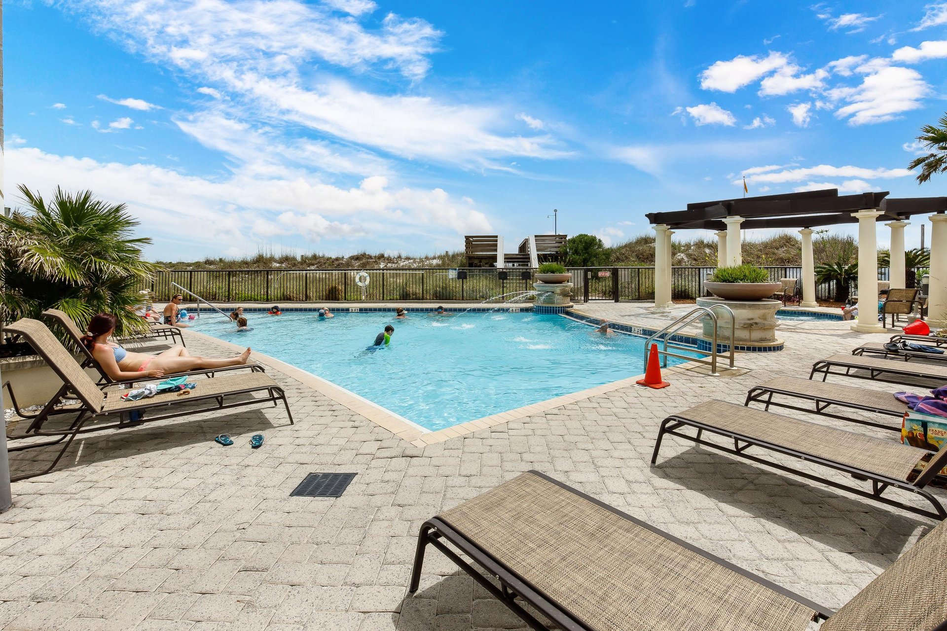 Lounge in the sun by the outdoor pool.