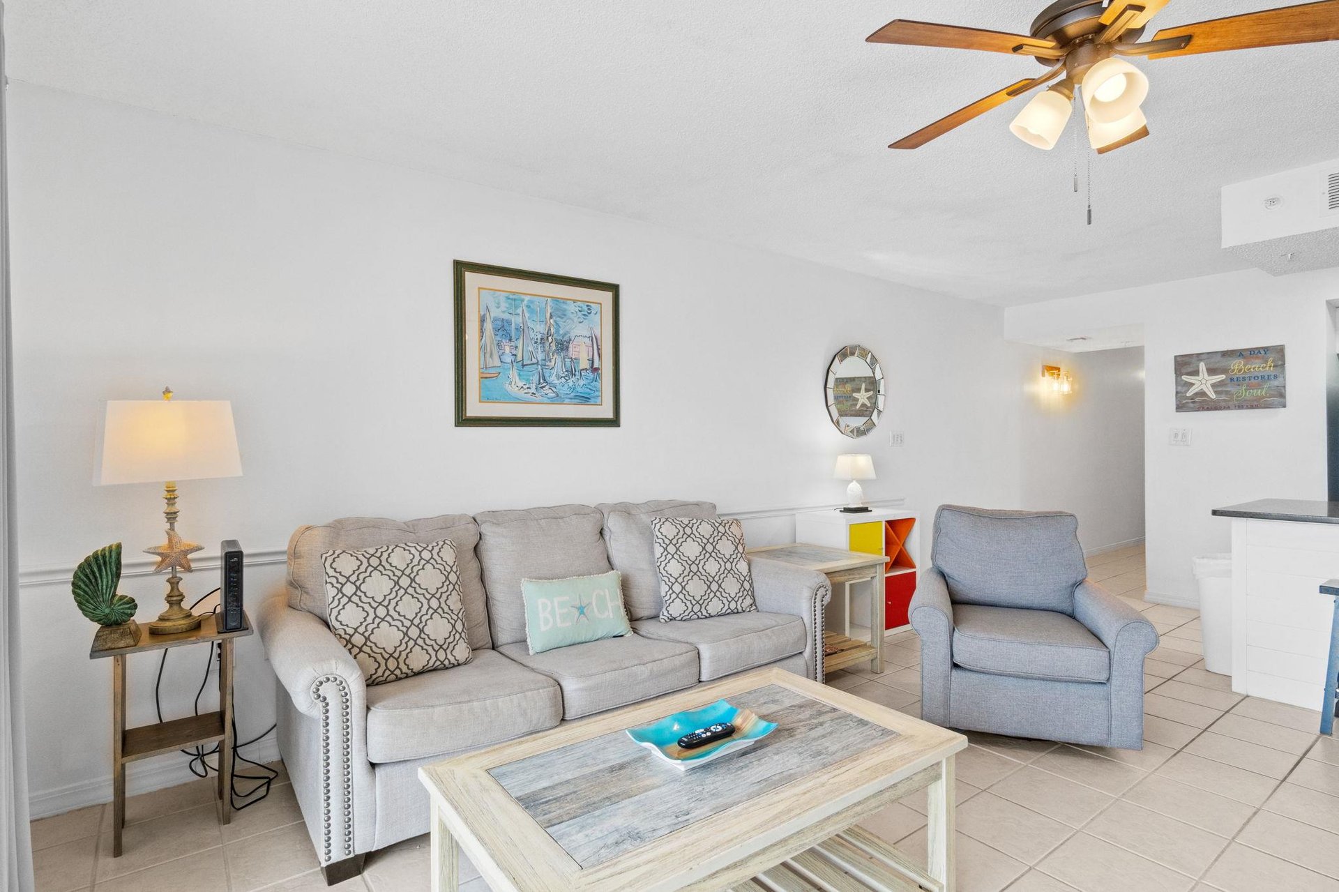 Tastefully decorated living room with plenty of seating for your entire family.