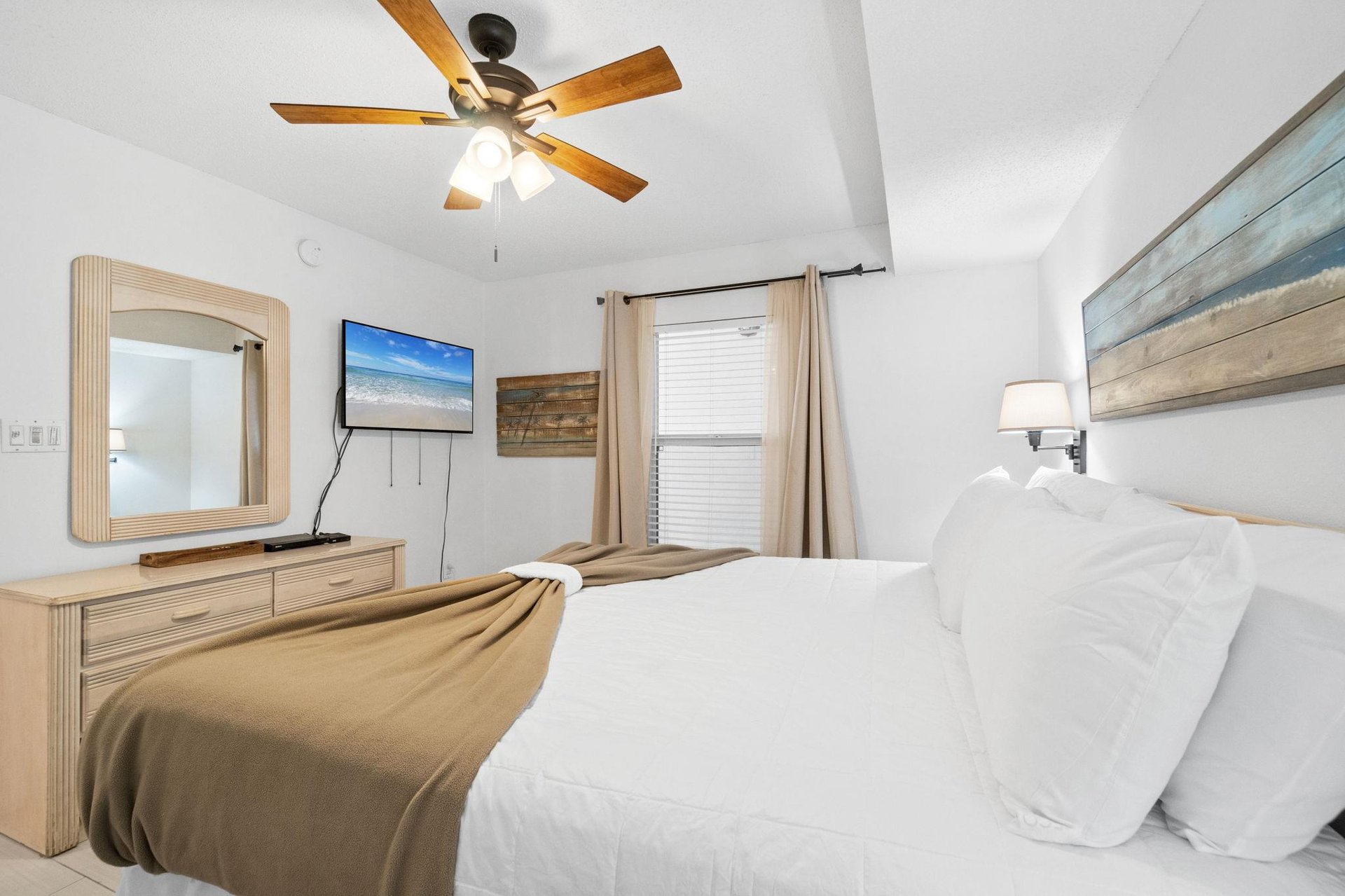 Additional views of the master bedroom featuring a nicely sized flat screen for all of your entertainment needs.