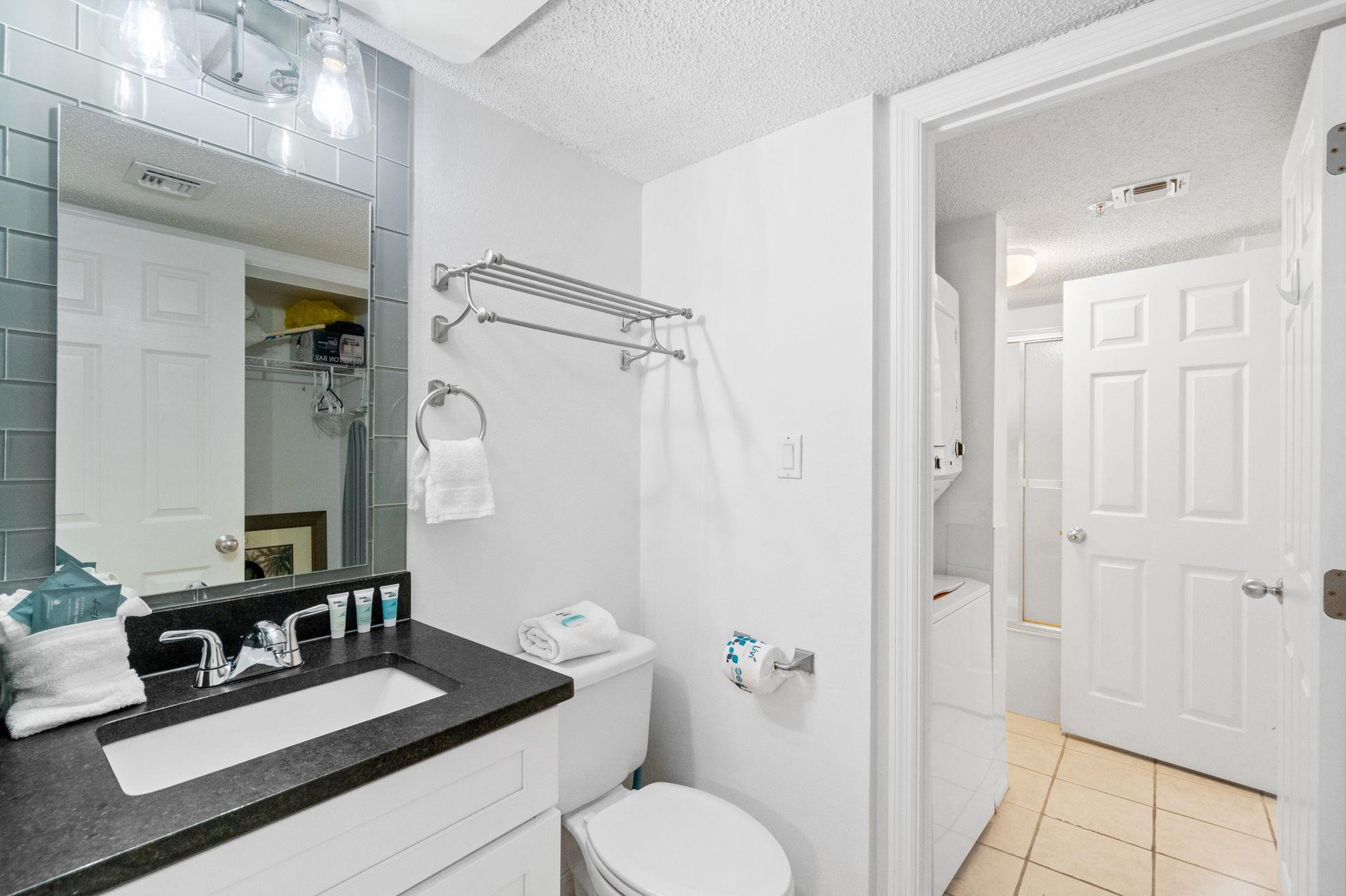 1 and 12 featuring the convenience of a divided vanity and tub area