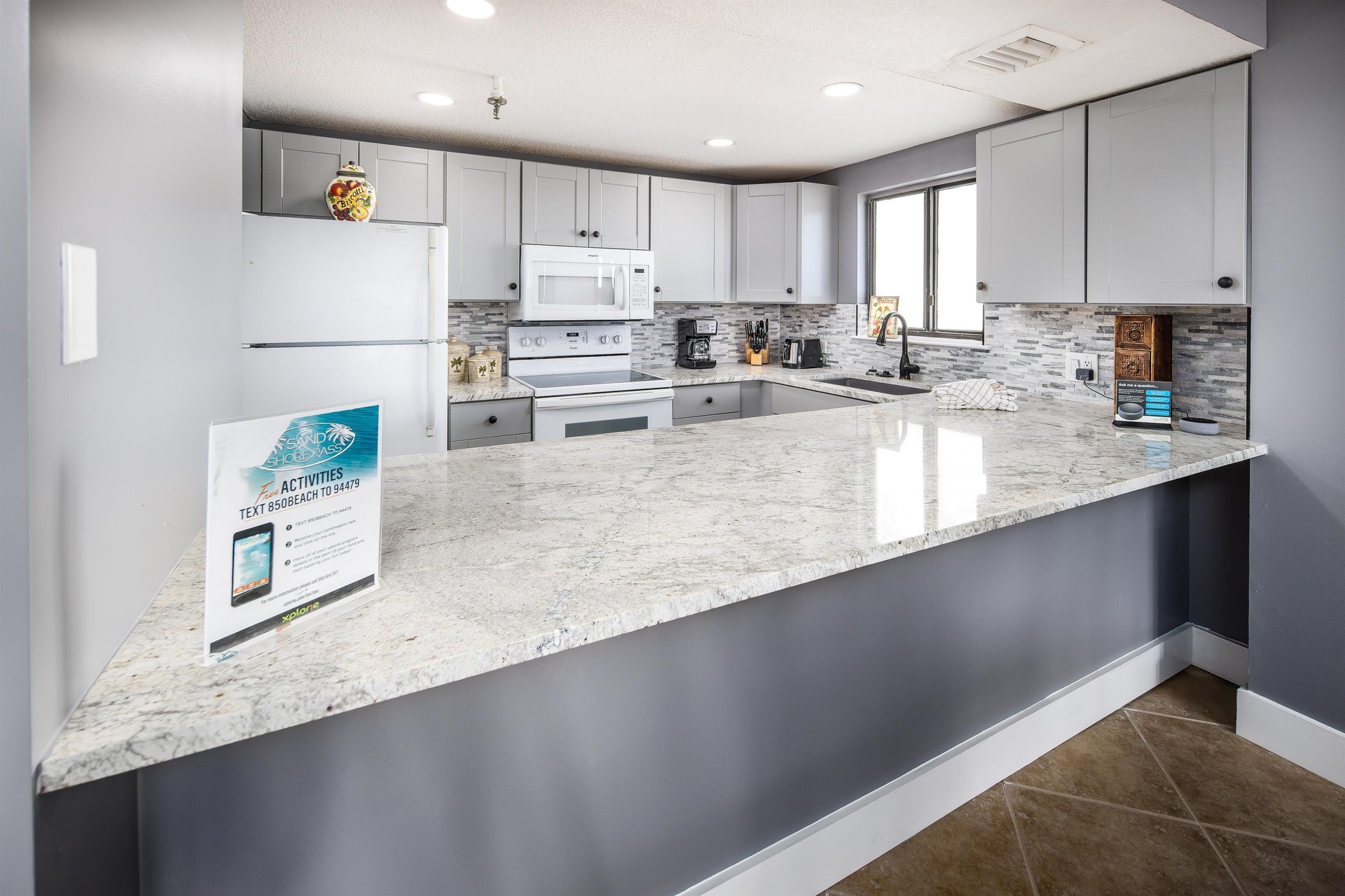 Granite counter tops and beautiful white cabinetry
