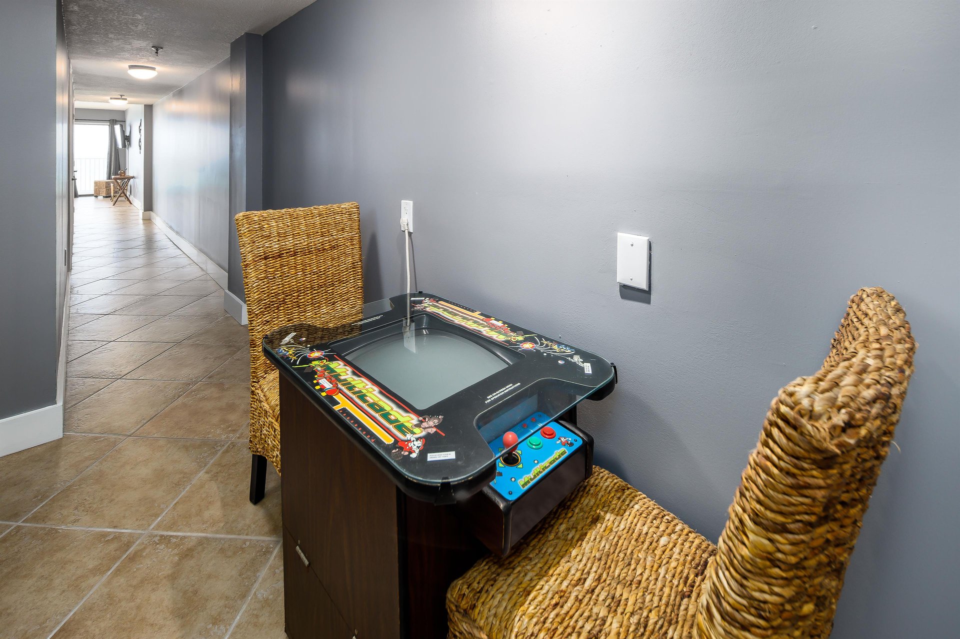 A GREAT addition to this gorgeous condo is an arcade game featuring multiple fun games