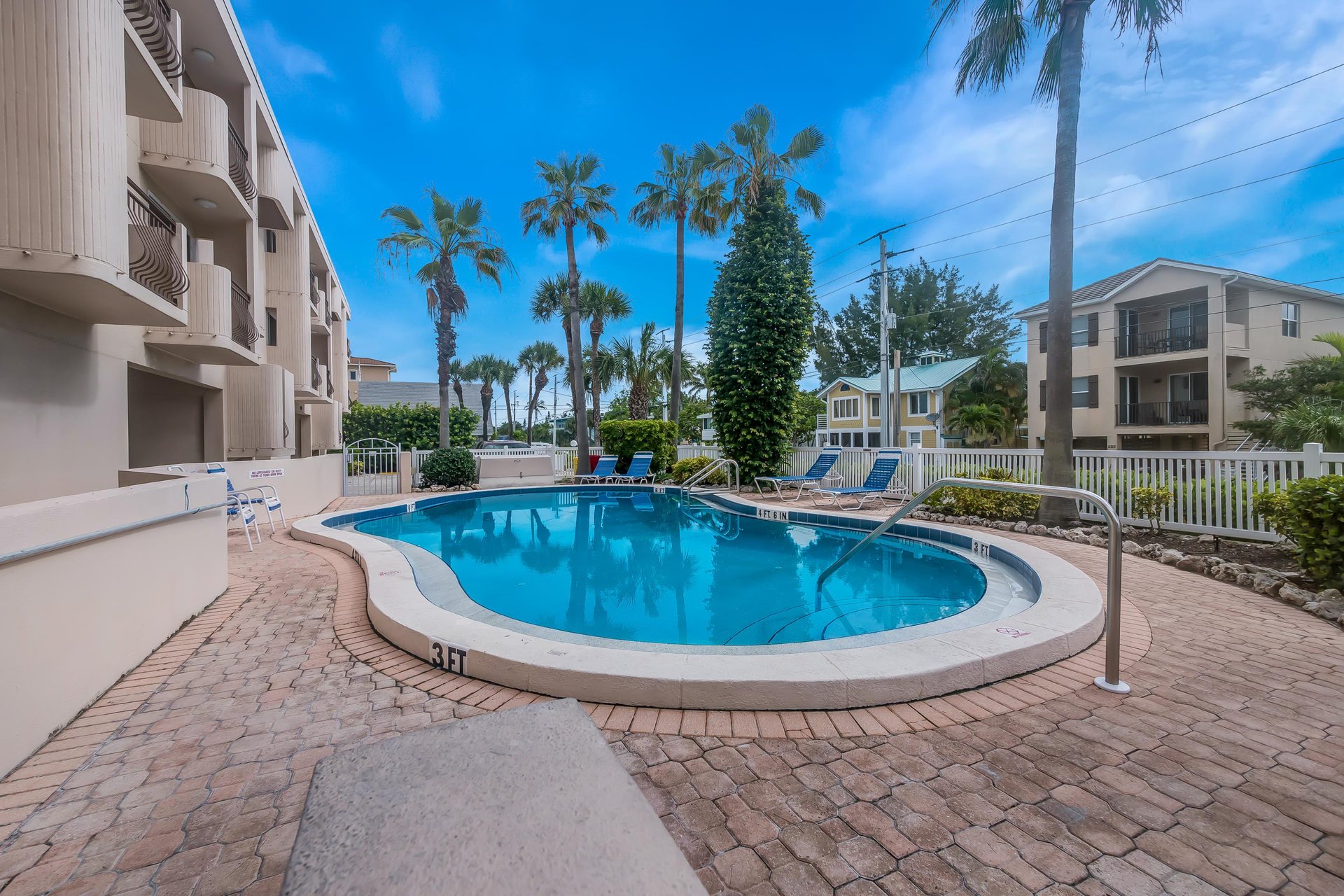 Community Pool with Lounge Chairs