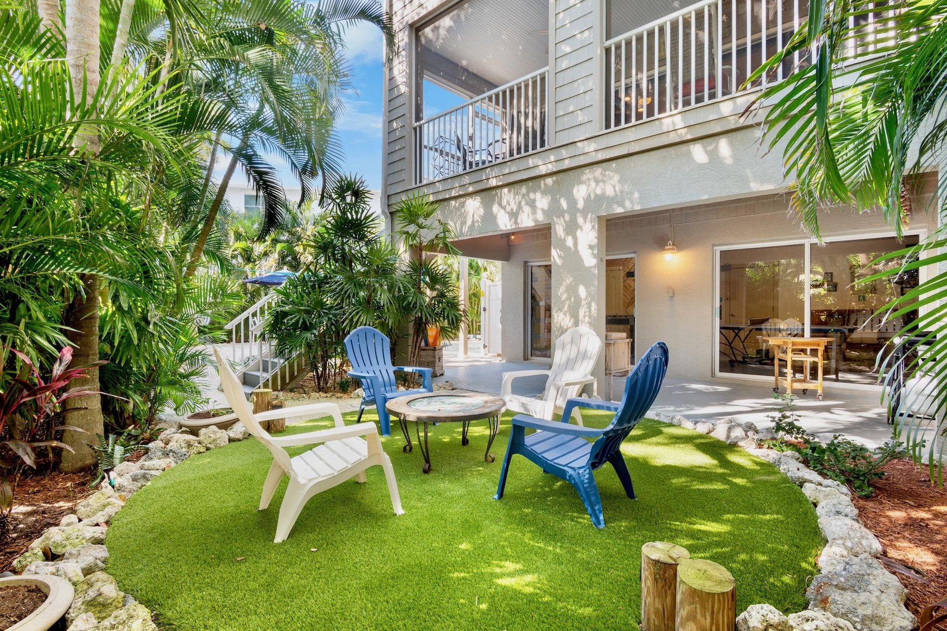 Colorful lounge chairs on lush green turf