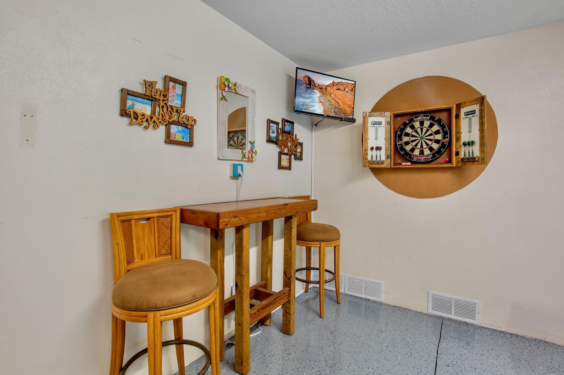 Game room with a dartboard and hightop seating