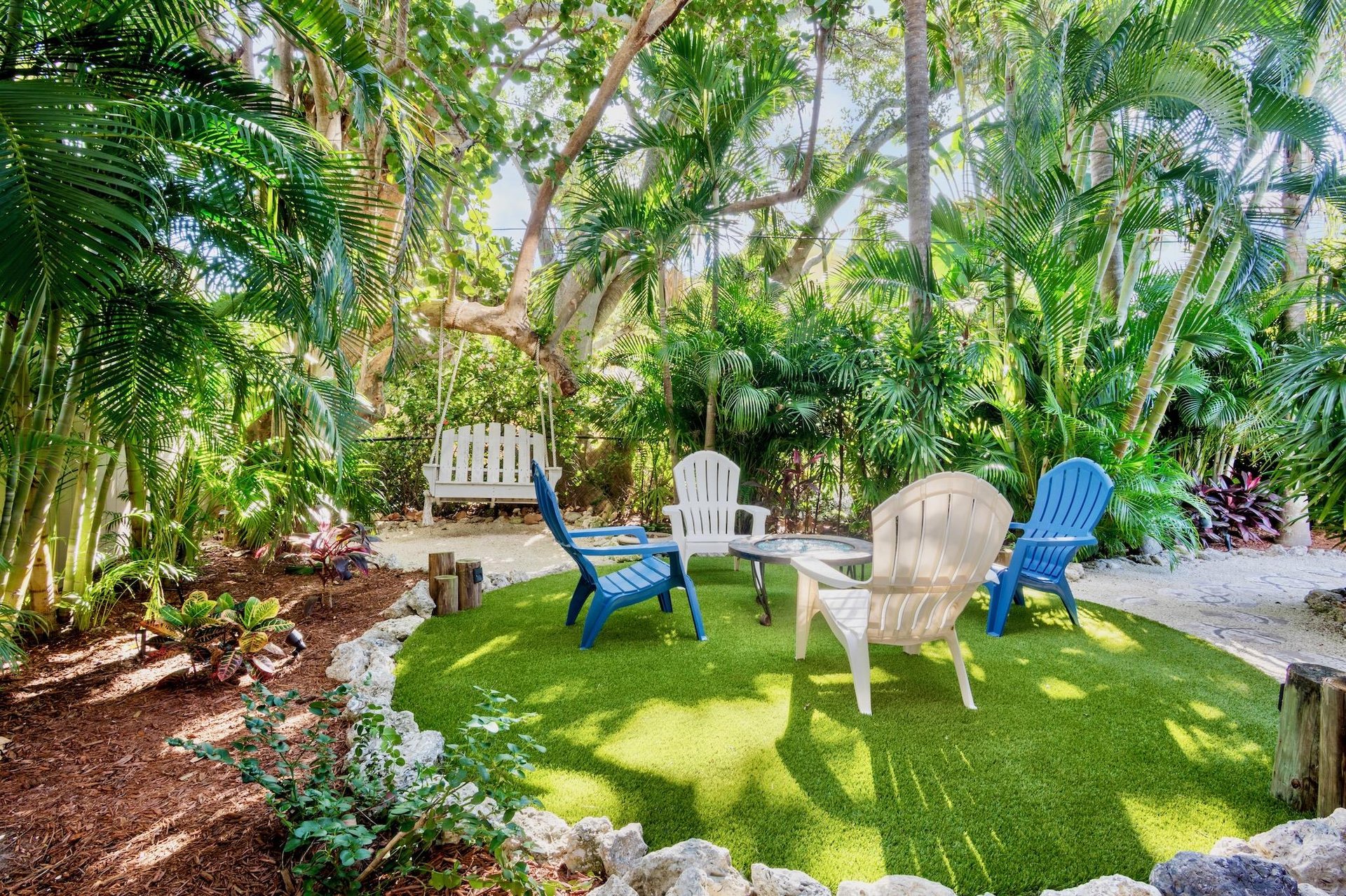 Tropical oasis with Adirondack chairs