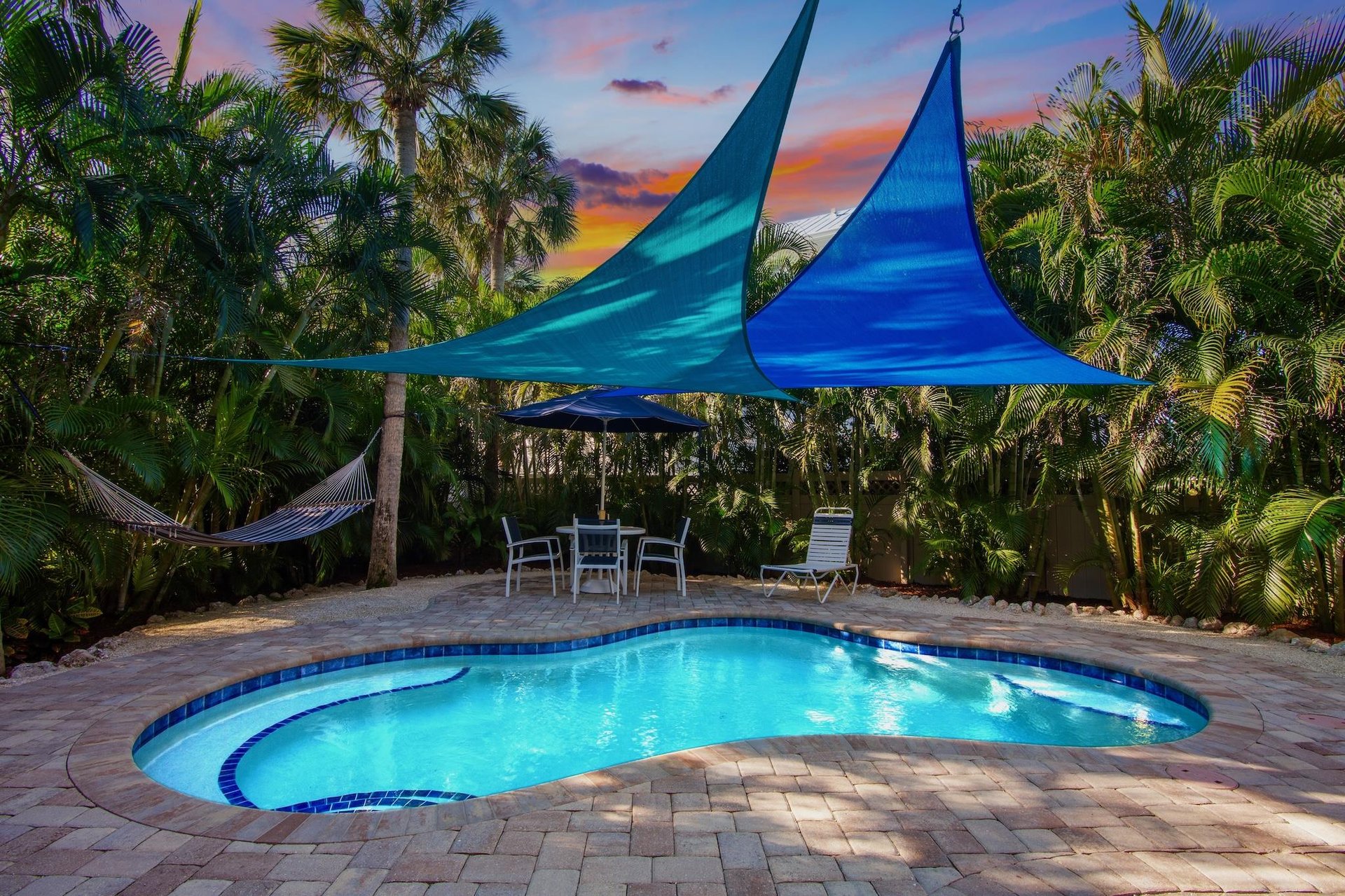 Private pool with shade sails, perfect outdoor retreat
