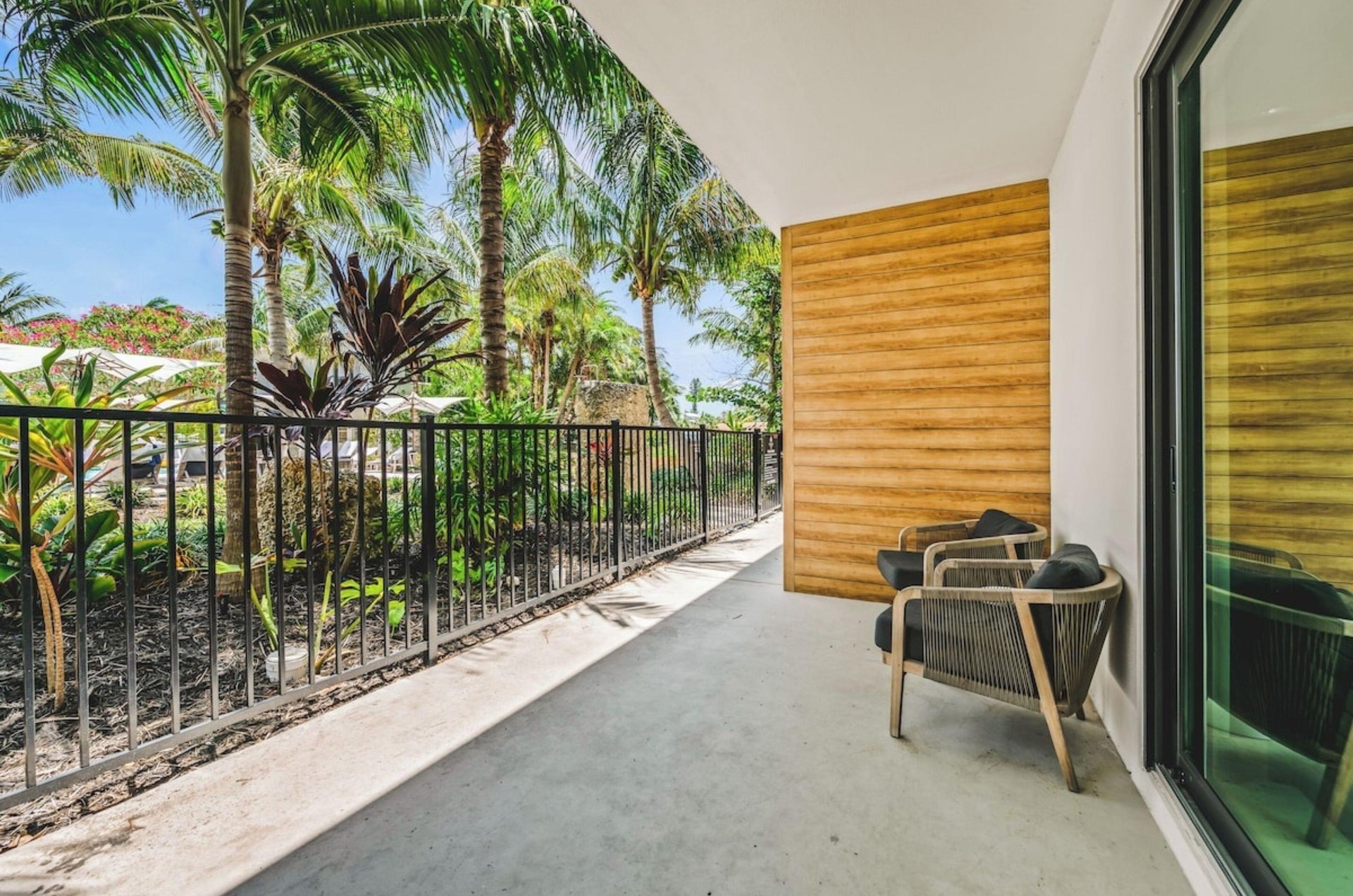A room with a balcony at Bali Hai Beachfront Resort and Spa in Holmes Beach, Florida
