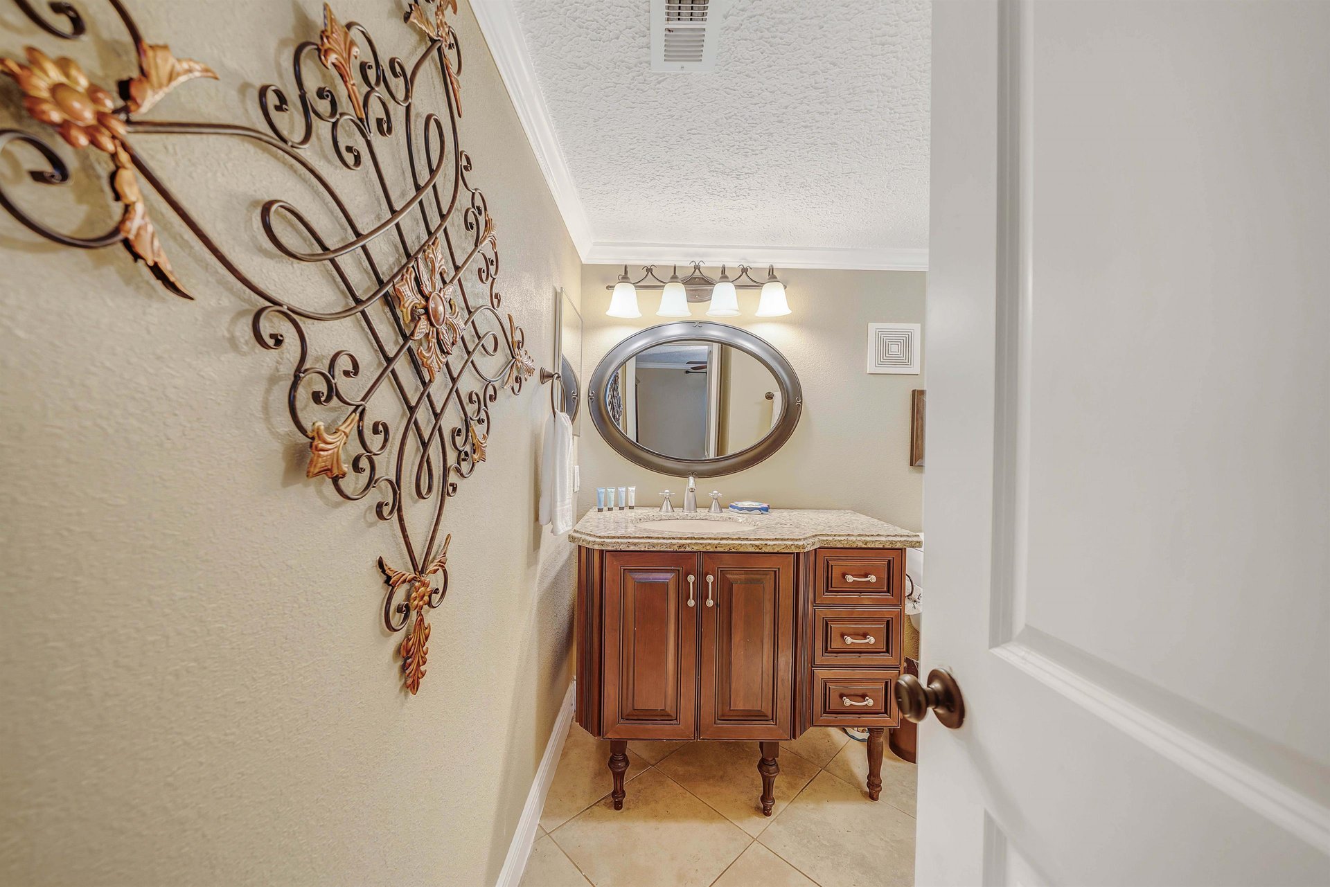The ensuite bathroom features a beautiful vanity and tubshower combo.