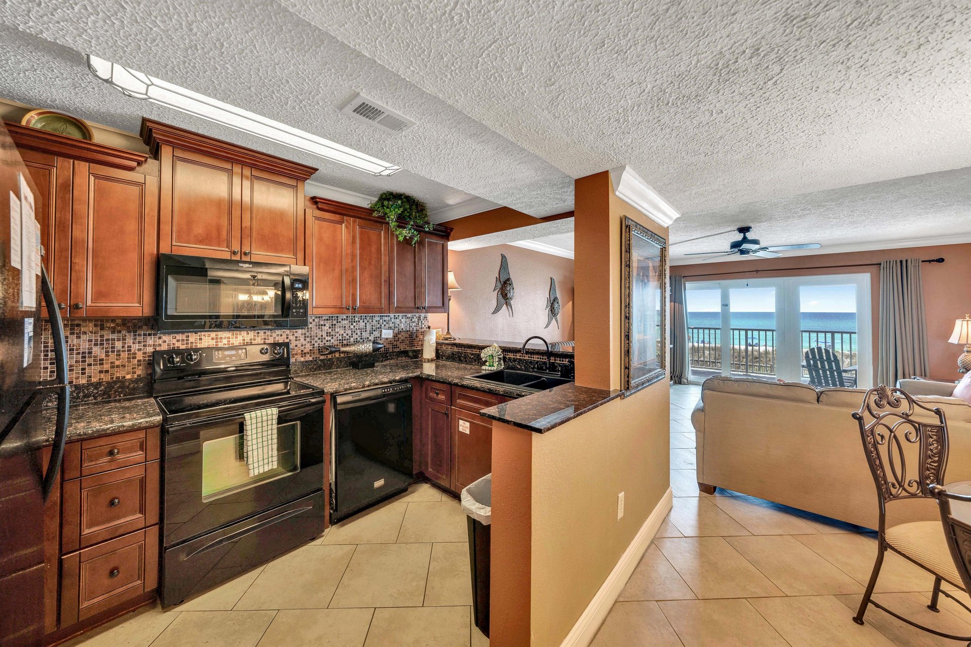 The fully equipped kitchen features granite countertops and has everything you need to prepare meals for family and friends.