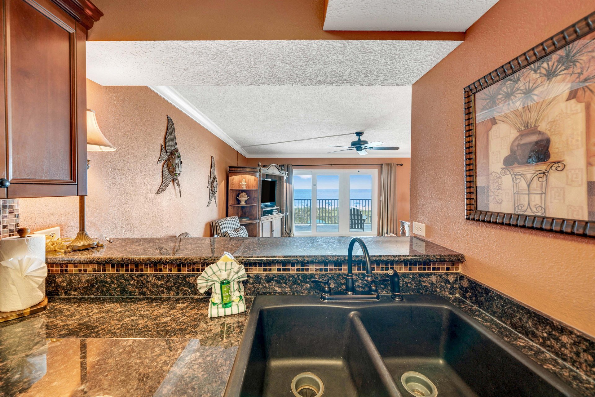 The fully equipped kitchen features granite countertops and has everything you need to prepare meals for family and friends.