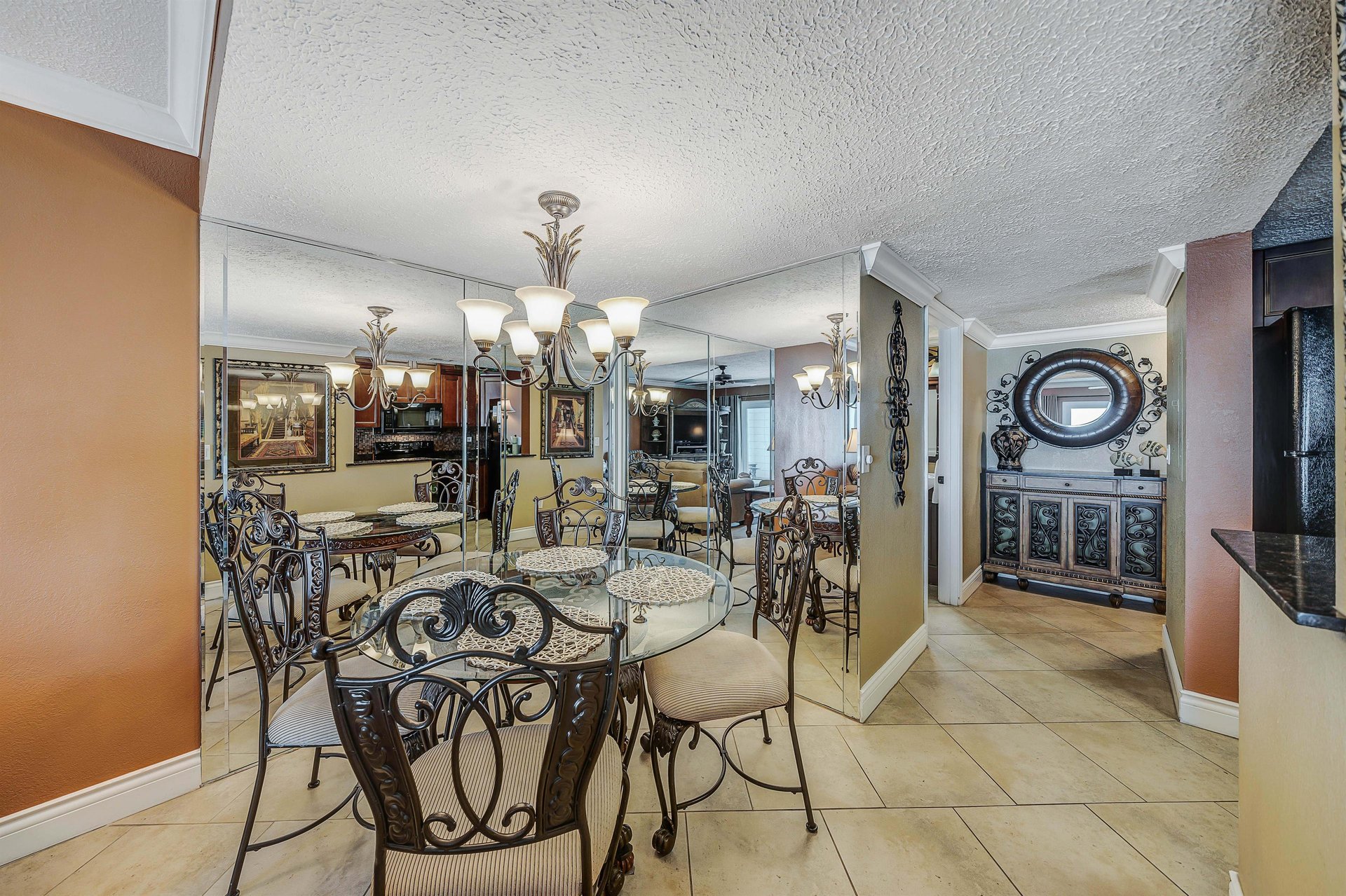 There is a dining table that seats 4, as well as additional breakfast bar seating.