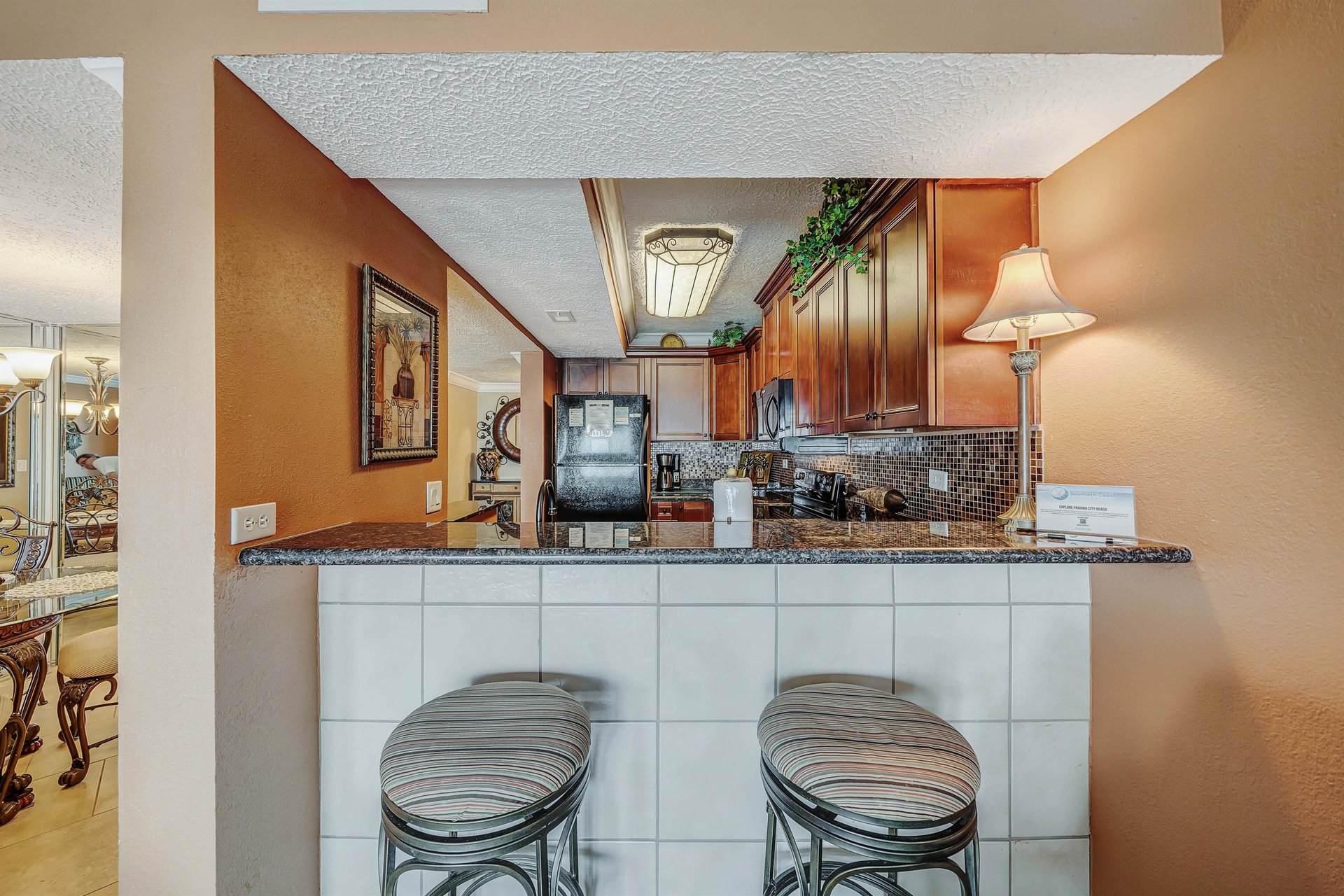 There is a dining table that seats 4, as well as additional breakfast bar seating.