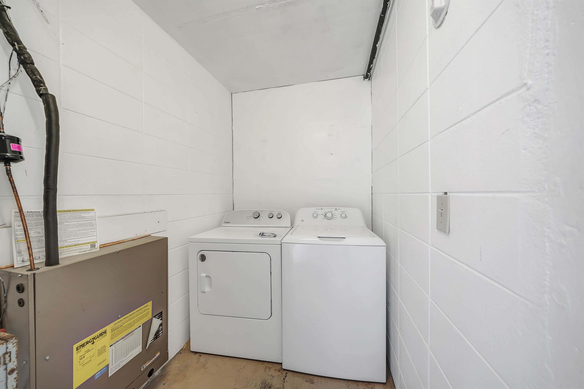Directly across from the units front door is a separate laundry room. This laundry room is for your units use only and is secured with a door code.
