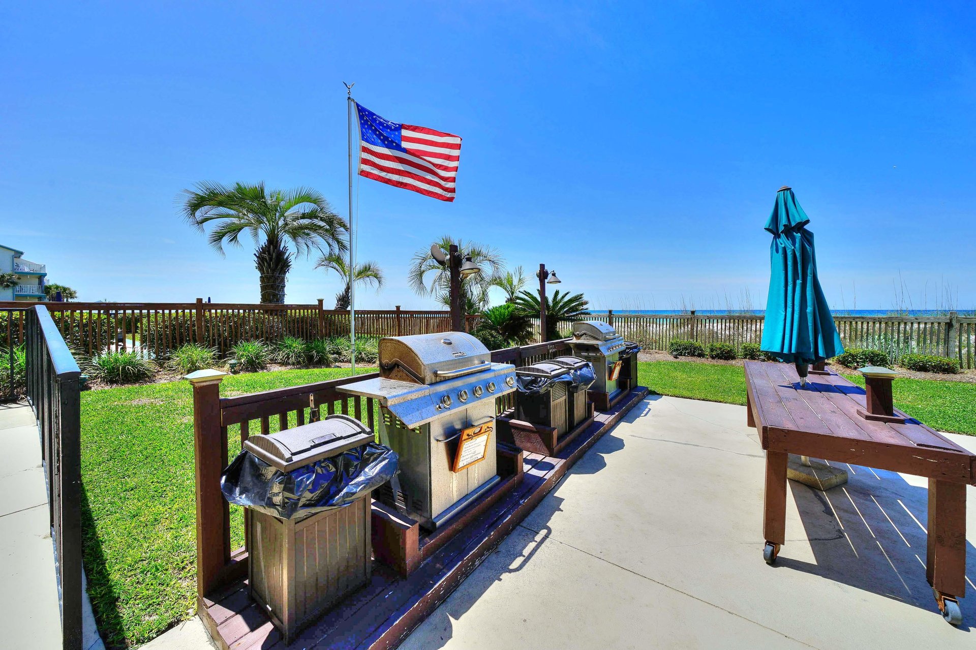 Grill a meal while overlooking the beach and pool.