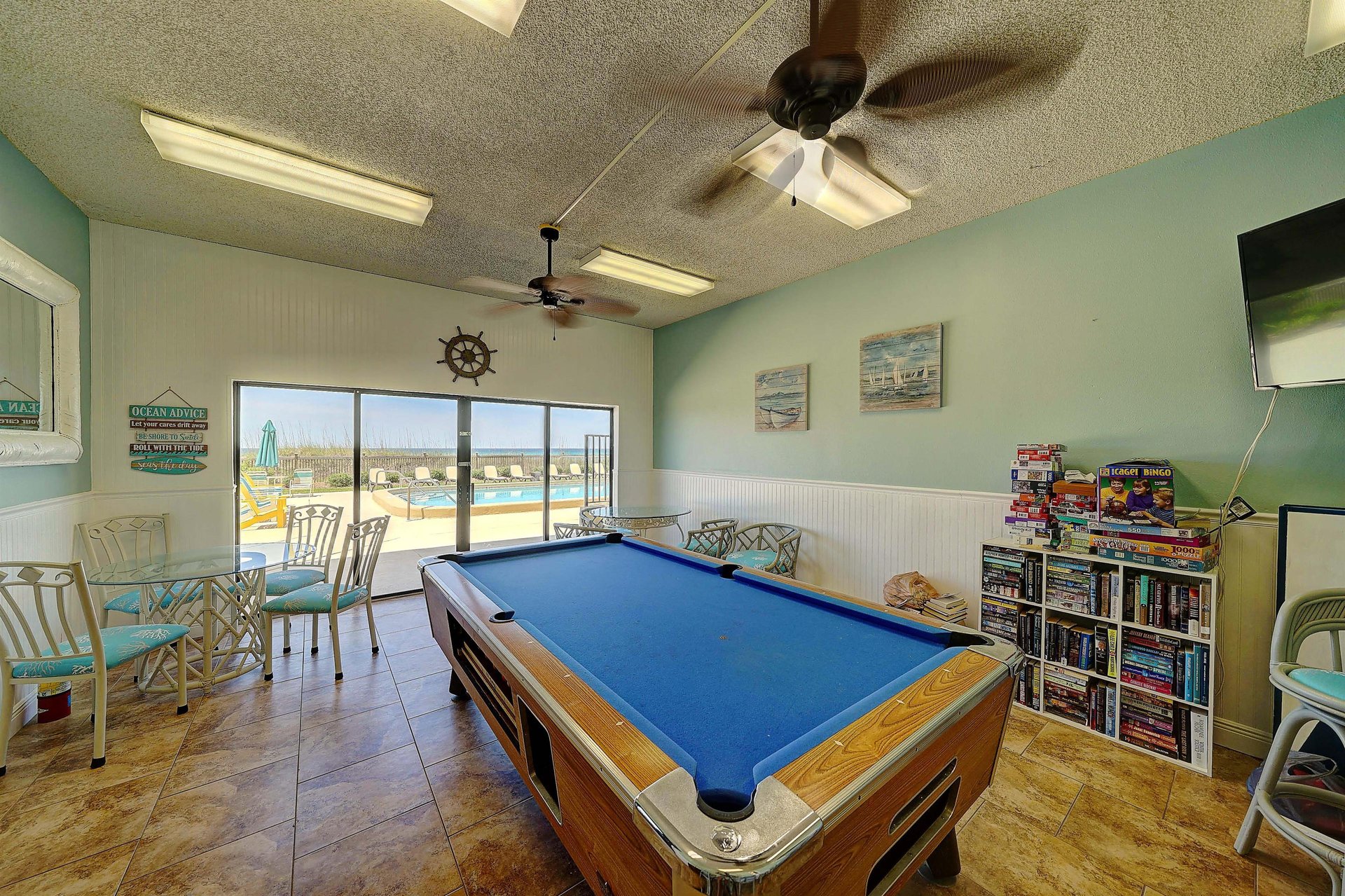 Take a break from the sun and play a game of pool in the game room.