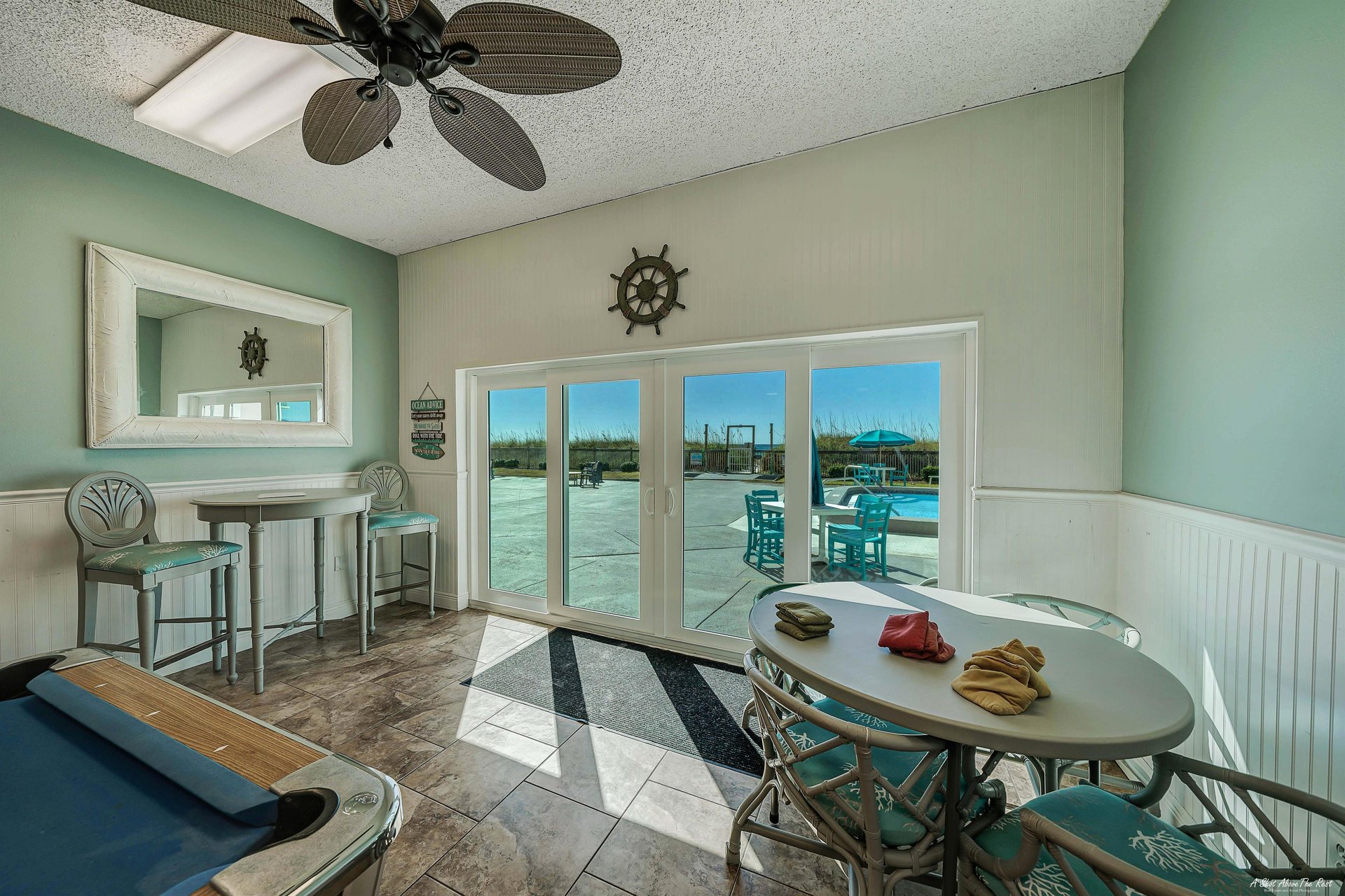 Take a break from the sun and play a game of pool in the game room.