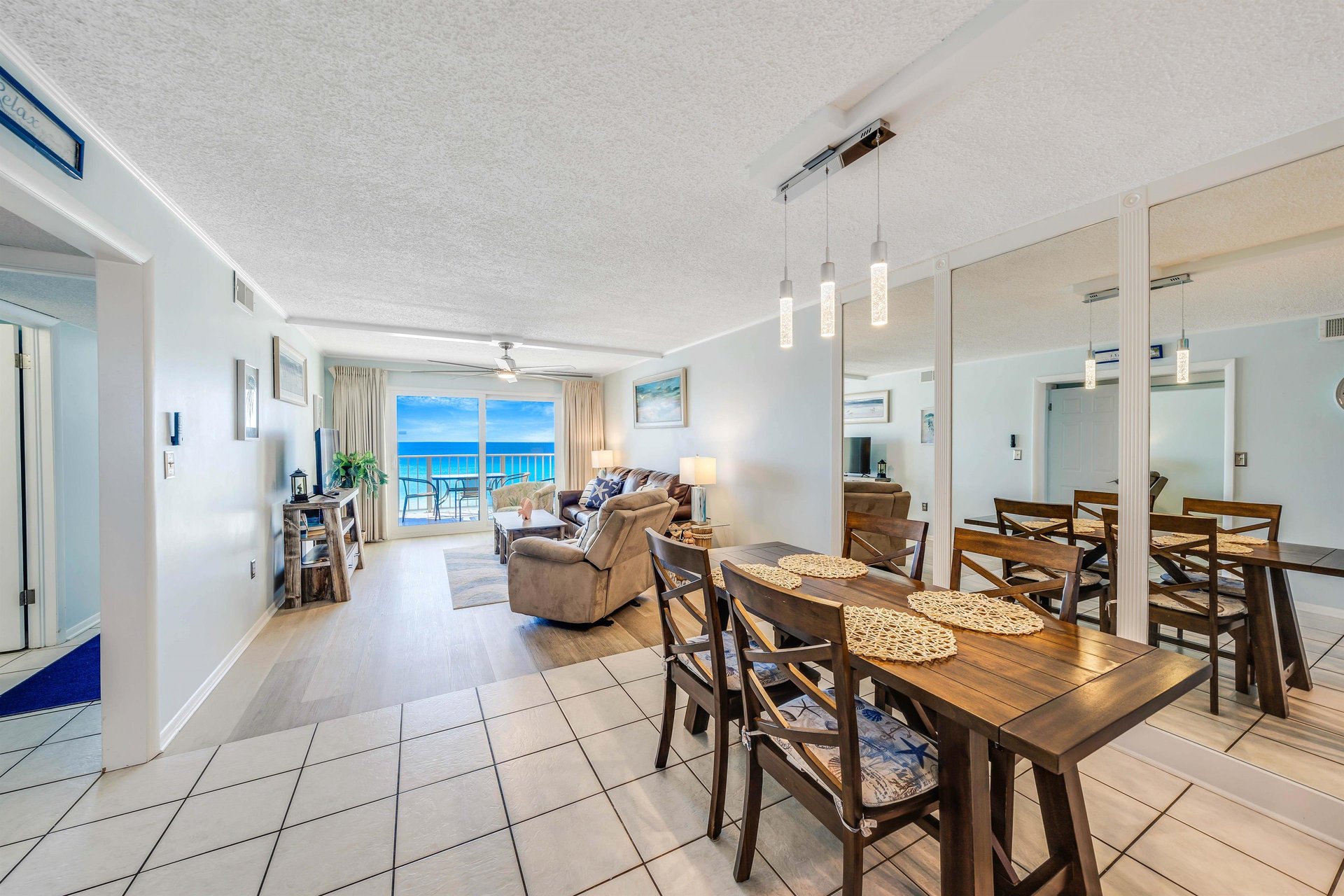 There is a dining table, perfect for enjoying a meal or playing a game, as well as additional breakfast bar seating.