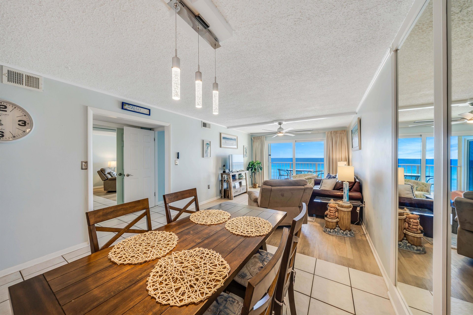 There is a dining table, perfect for enjoying a meal or playing a game, as well as additional breakfast bar seating.