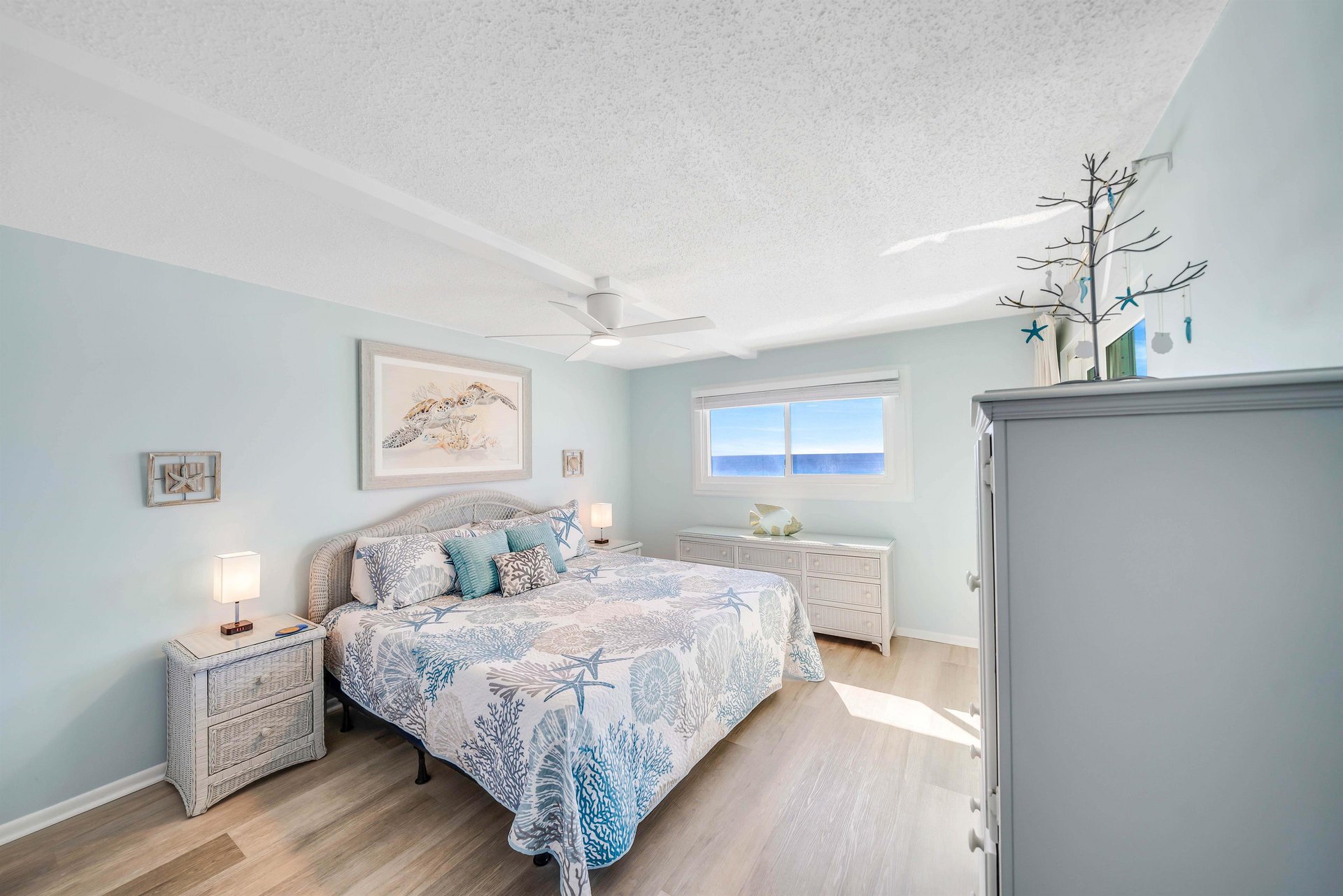 The gulf front master bedroom offers guests a Kingsized bed, ensuite bathroom, television, and separate access to the balcony.