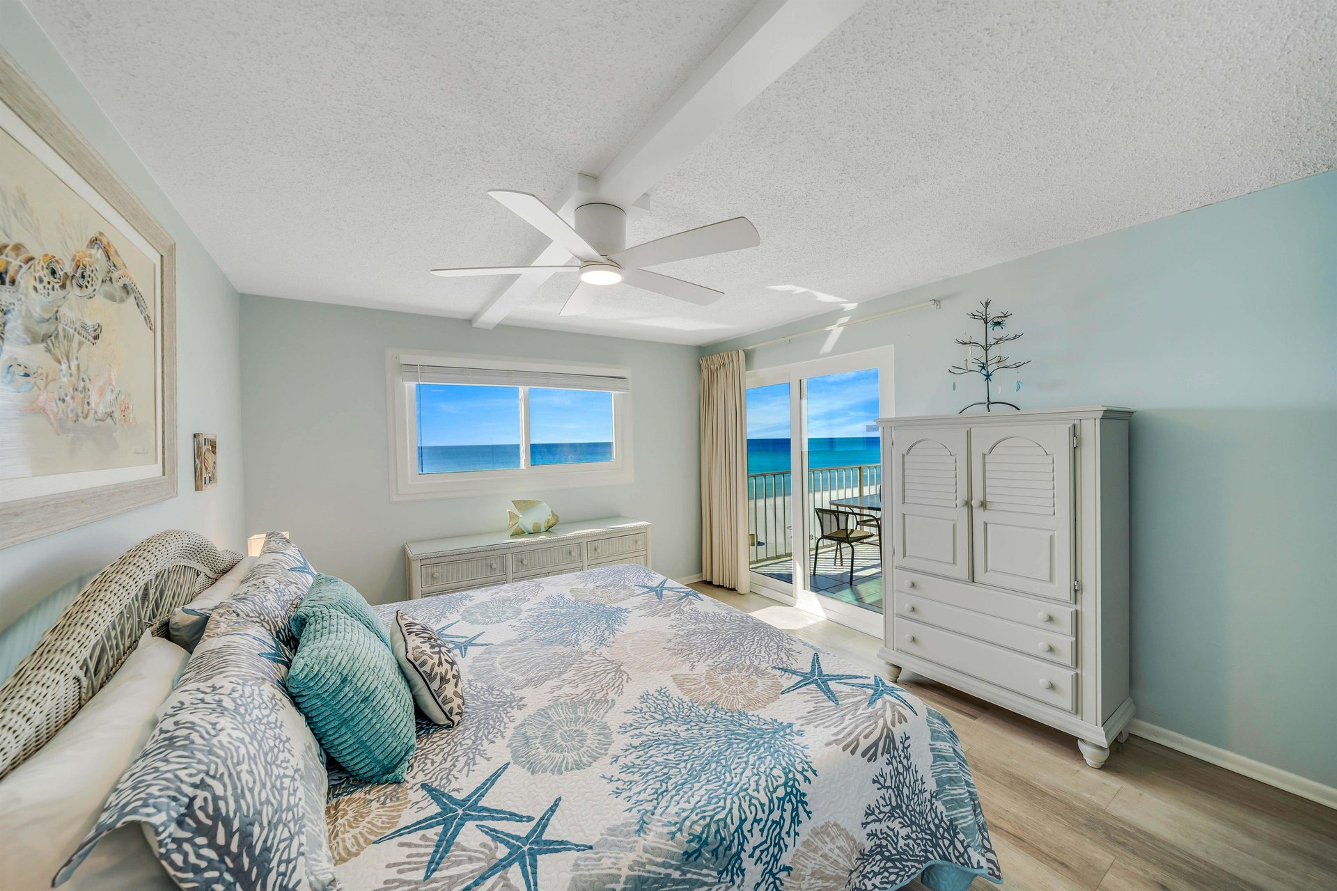 The gulf front master bedroom offers guests a Kingsized bed, ensuite bathroom, television, and separate access to the balcony.