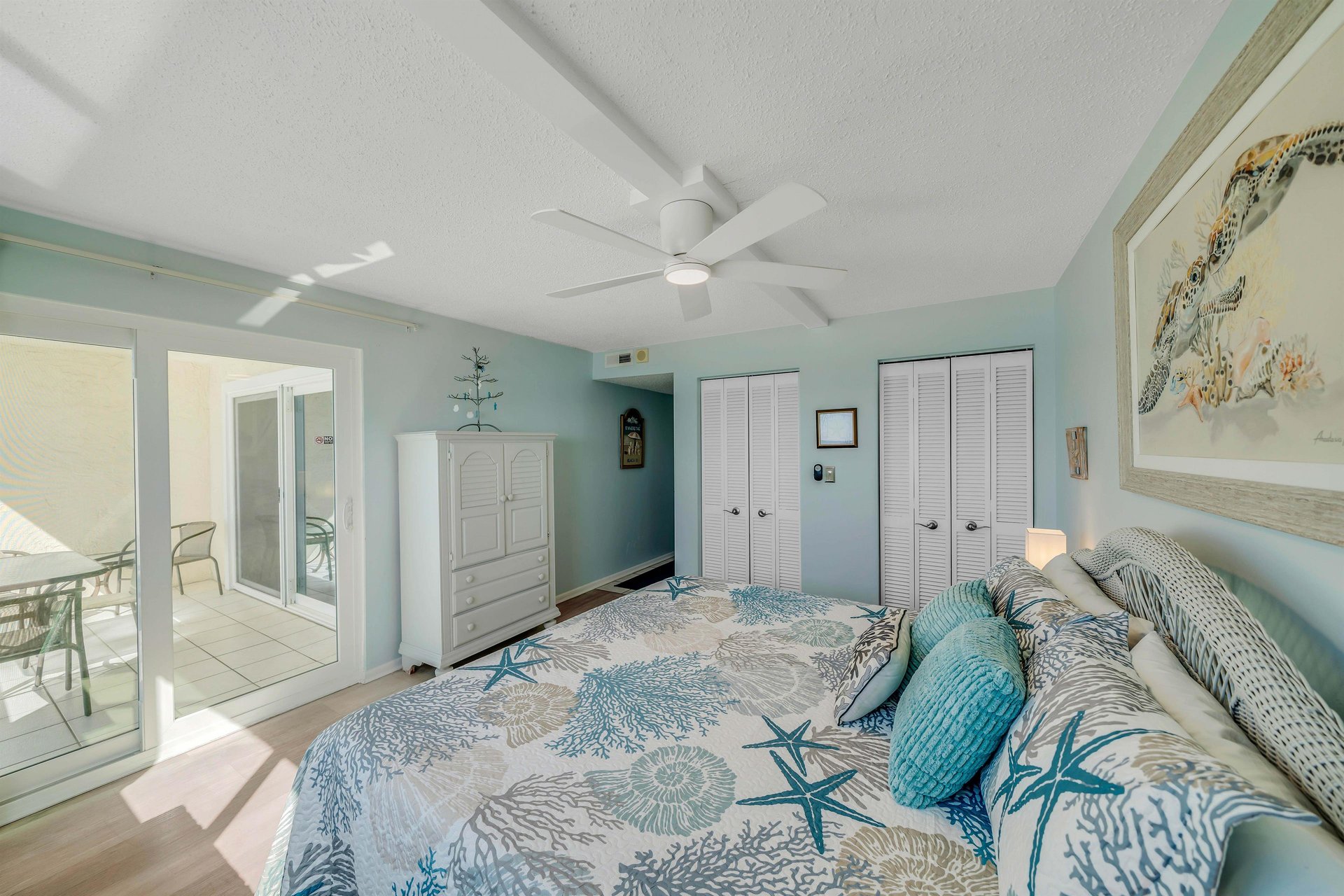 The gulf front master bedroom offers guests a Kingsized bed, ensuite bathroom, television, and separate access to the balcony.