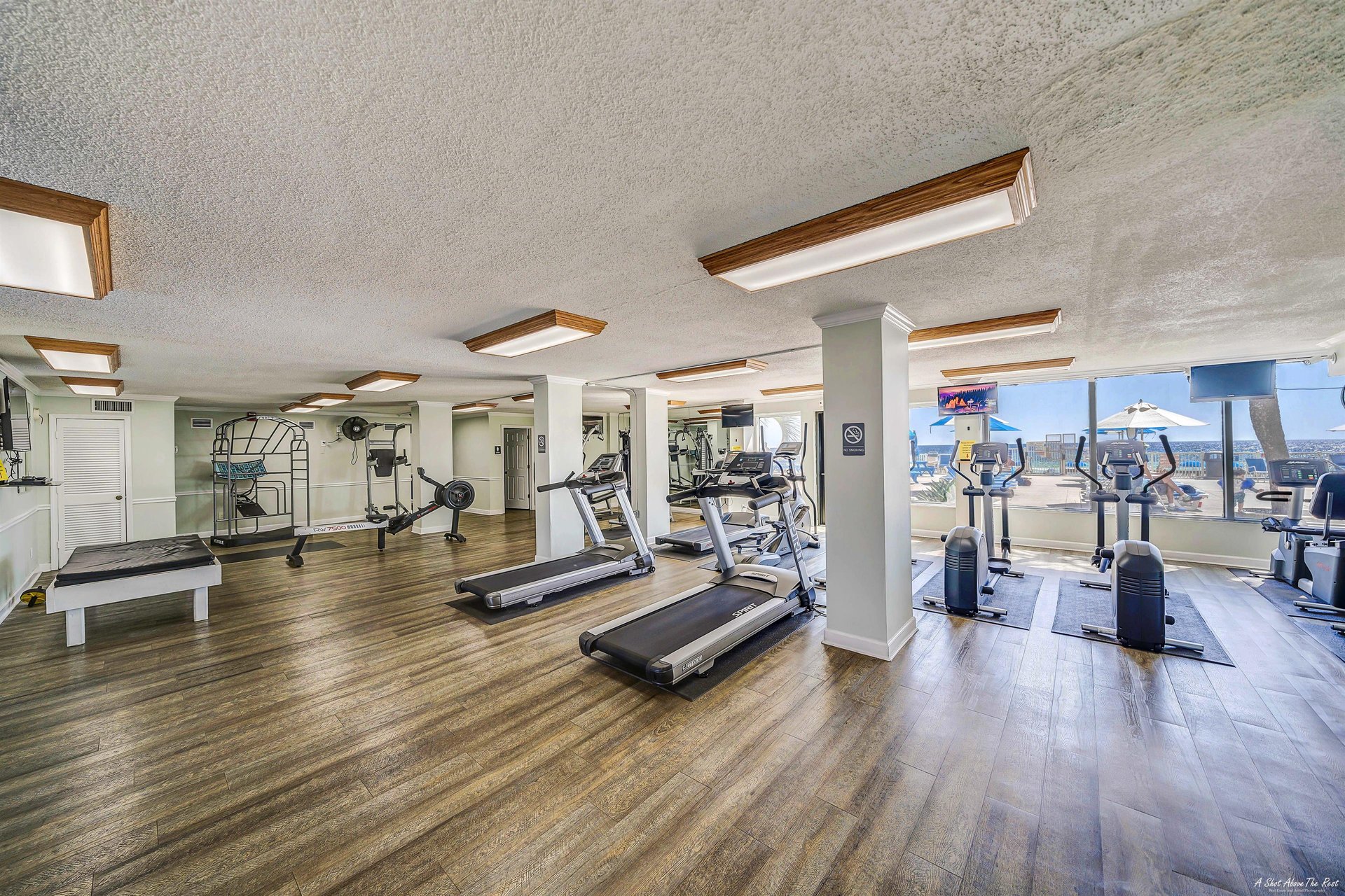 Stay beach body ready in the fitness center overlooking the pool.