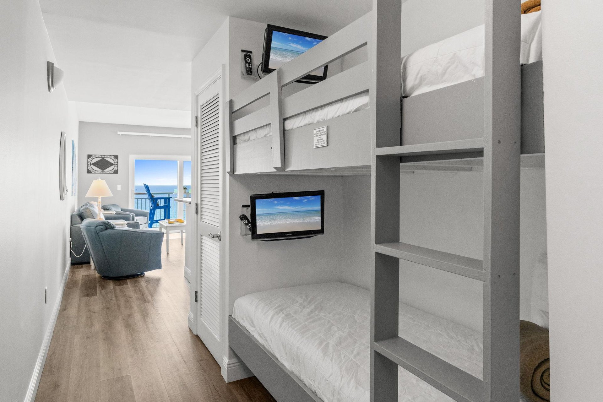 Bunk set in the hallway provides extra sleeping space for two children and flat screen TVs top and bottom with remote controls. Cant beat this awesome feature.