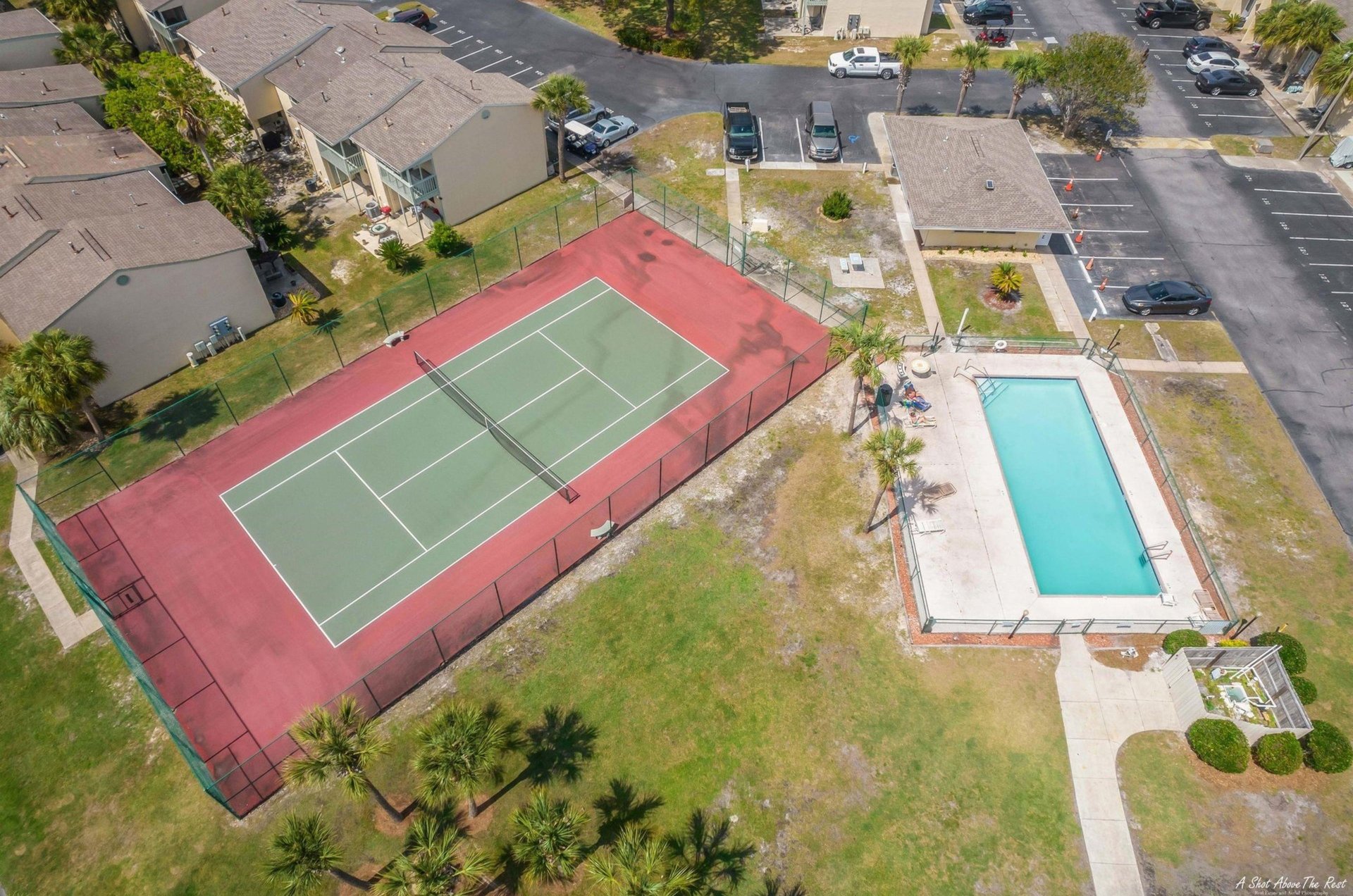 The outdoor pool and tennis courts