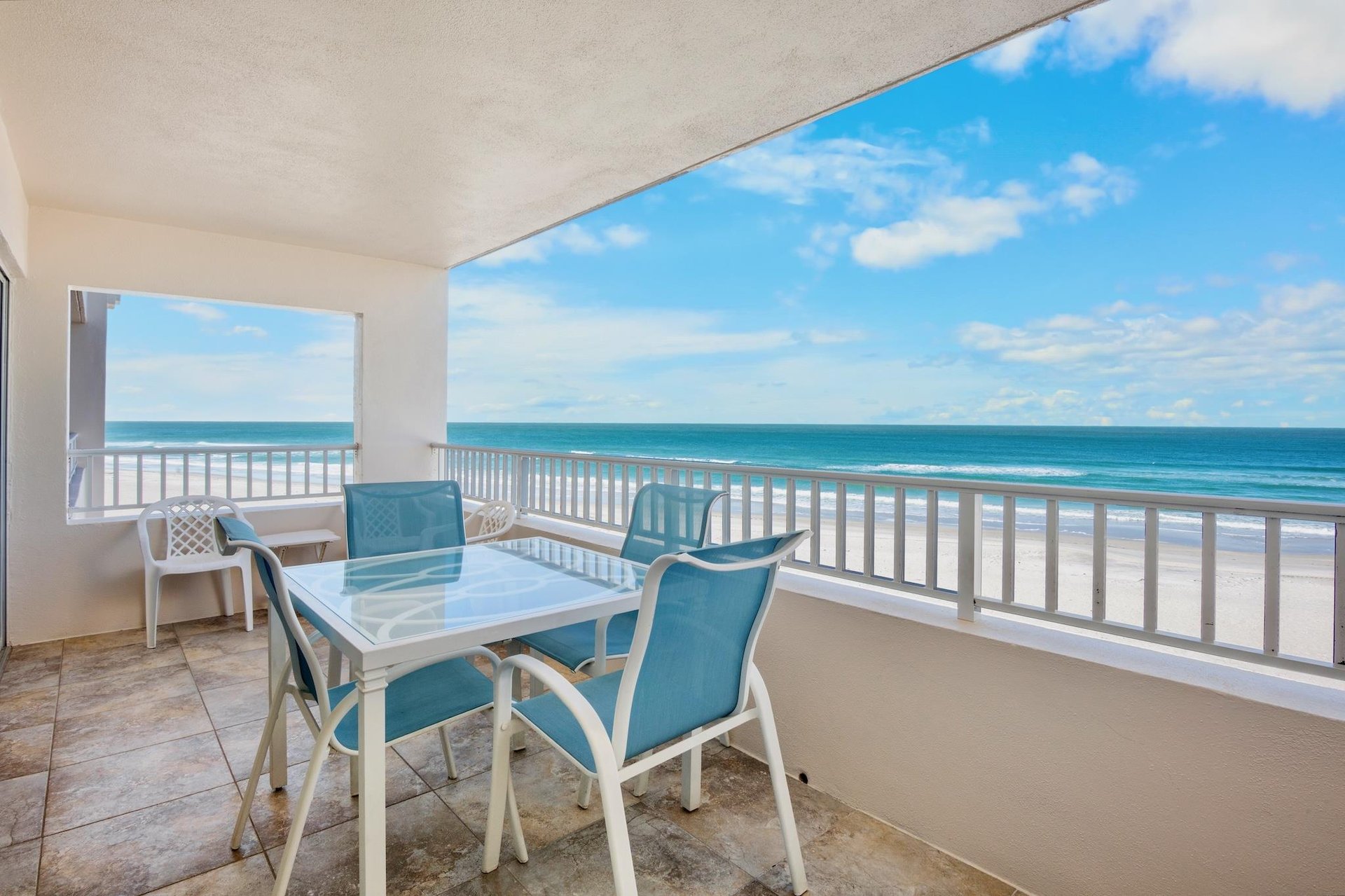 Private oceanfront balcony with dining