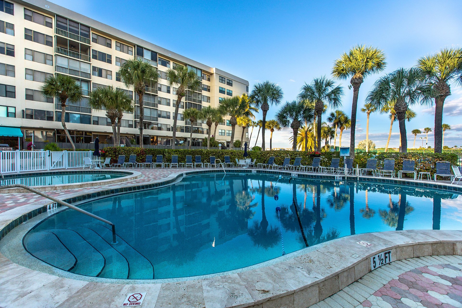 Dive into crystalclear waters surrounded by swaying palms and modern comfort at your tropical escape.