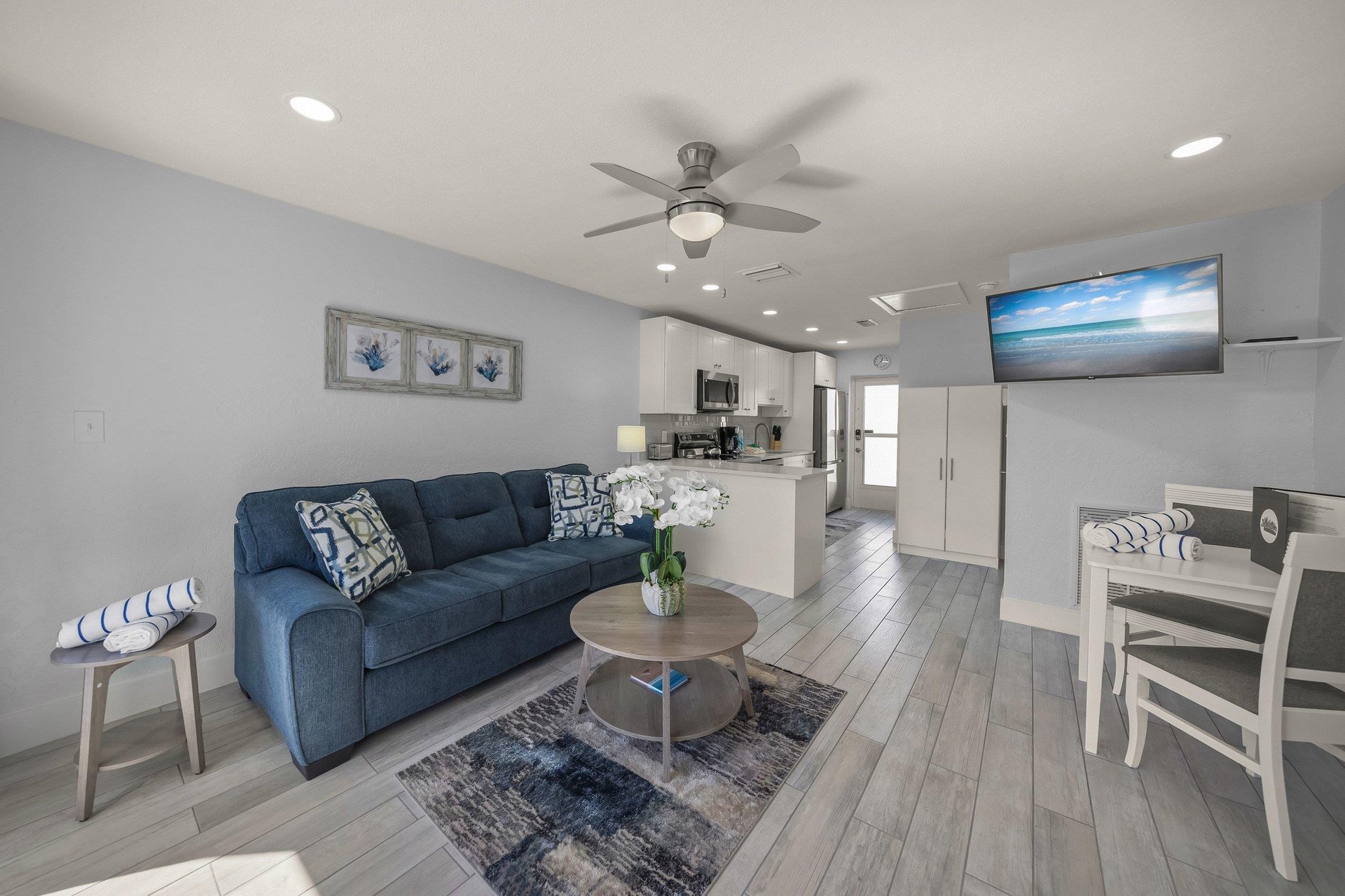 Relax in this bright, modern space where coastal blues meet crisp whites. Your openplan living flows seamlessly into the full kitchen.