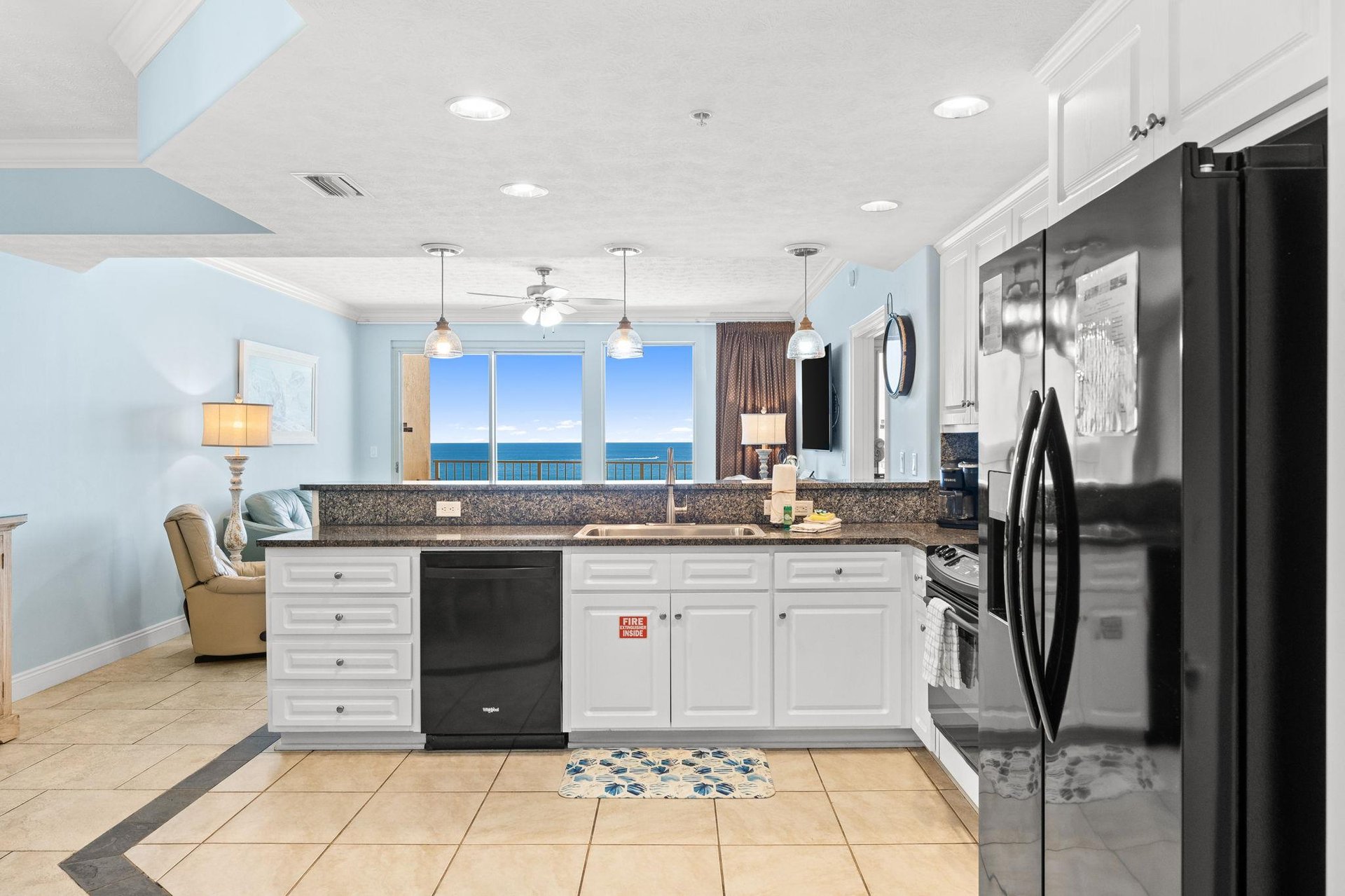 The fully equipped kitchen features granite countertops and has everything you need to prepare meals for family  friends.